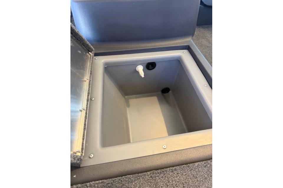 2026 Tracker Bass Tracker Classic XL livewell with open lid and drain plug.