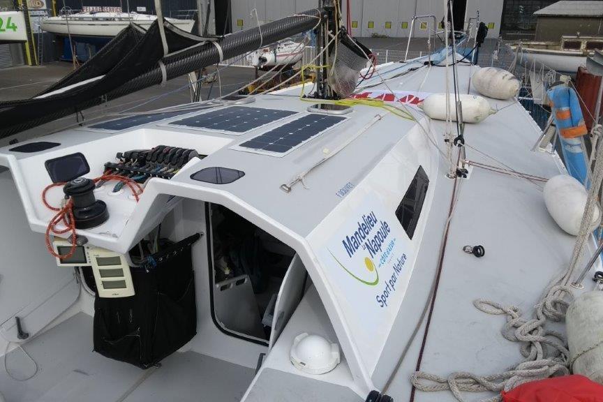 Sailboat Akilaria RC2 Class 40, 2008 model, with solar panels and nautical equipment on deck.