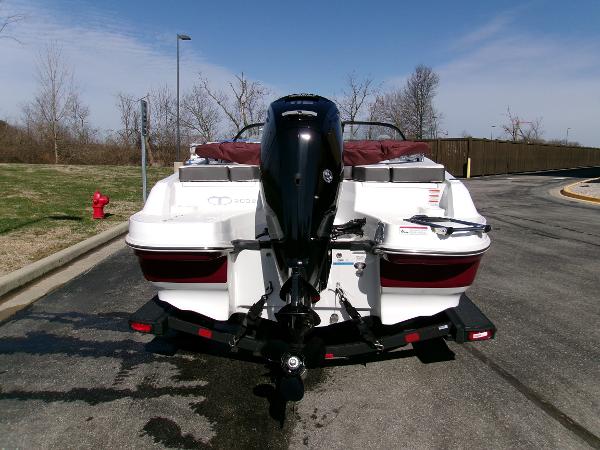 2024 Tahoe 200 S boat on trailer, rear view, parked outdoors.