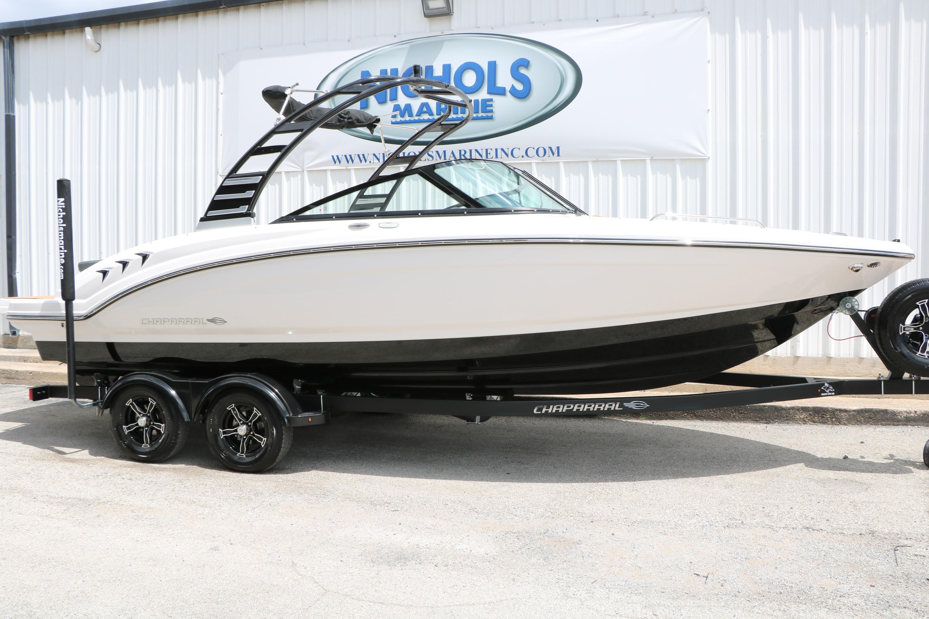 2025 Chaparral 23 SSi boat on trailer, displayed outside Nichols Marine.