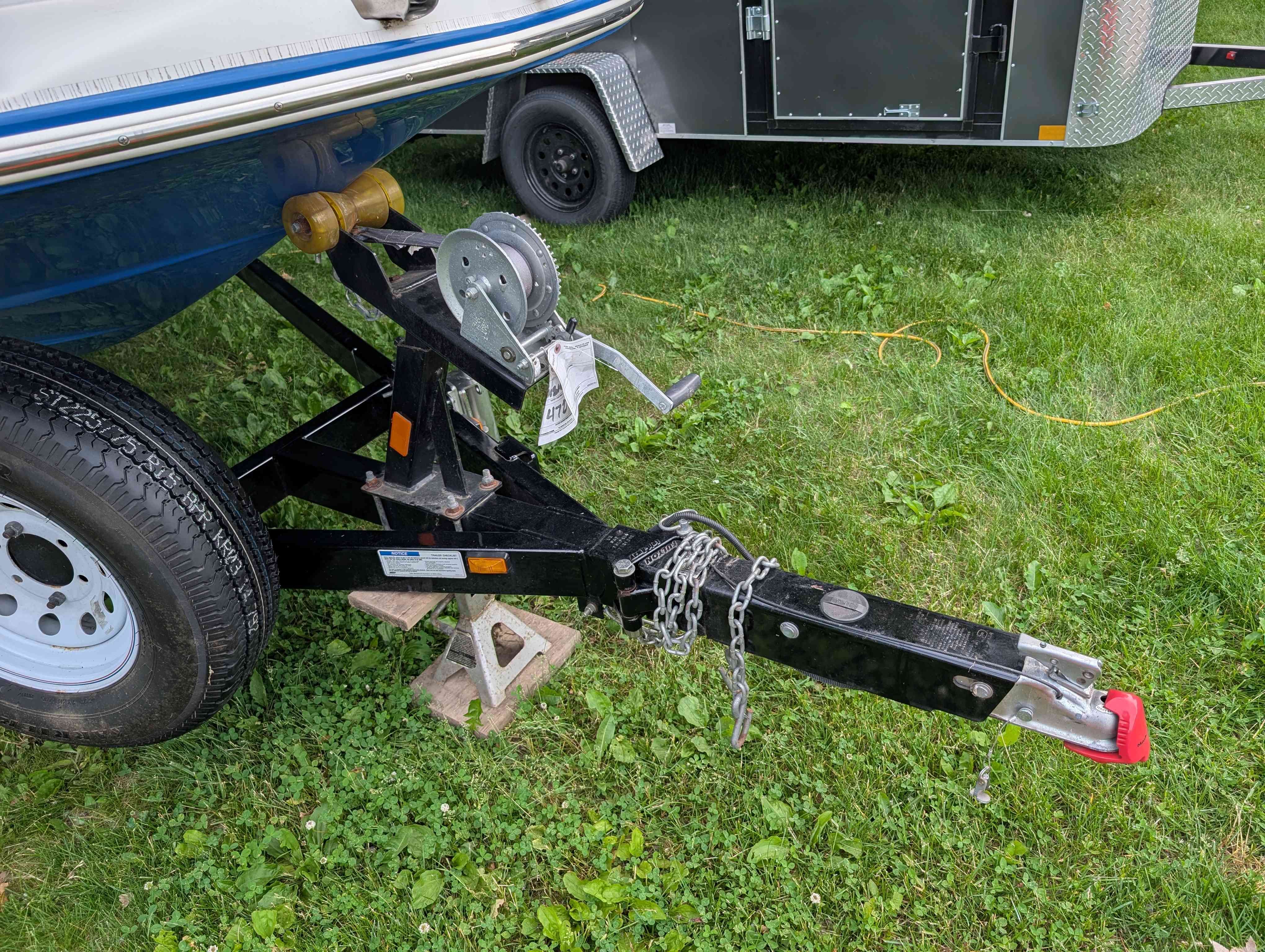 Starcraft 2000 boat trailer on grass, year 2015.