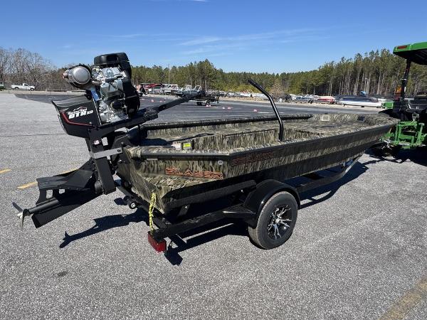 2025 SeaArk 1752 Slayer Pro boat on trailer in parking lot.