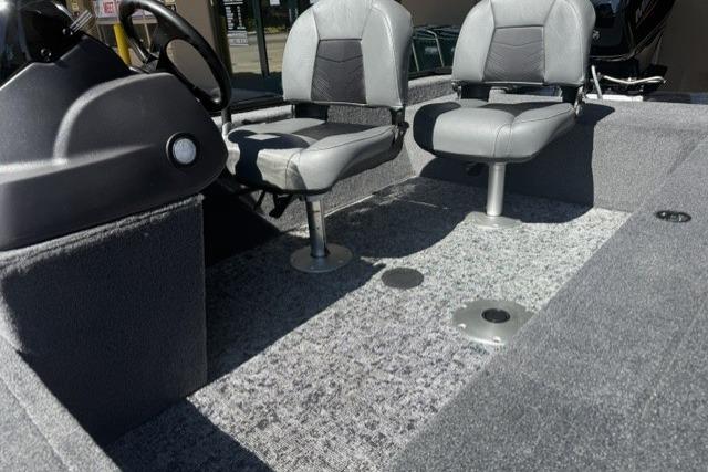 2026 Tracker Super Guide V-16 SC boat interior with two gray seats and carpeted floor.