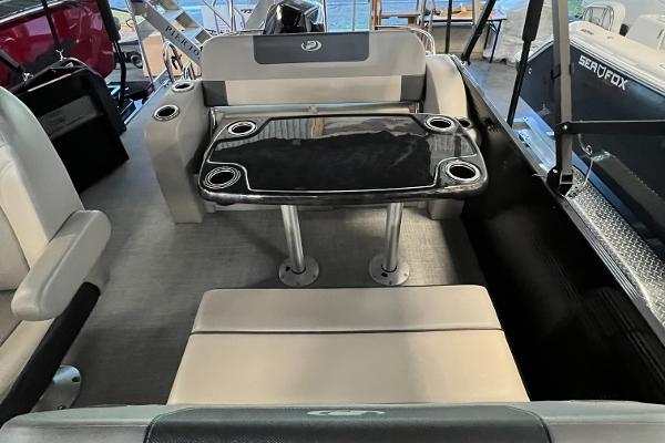 2024 Princecraft Quorum 23 RL interior with seating and table setup.