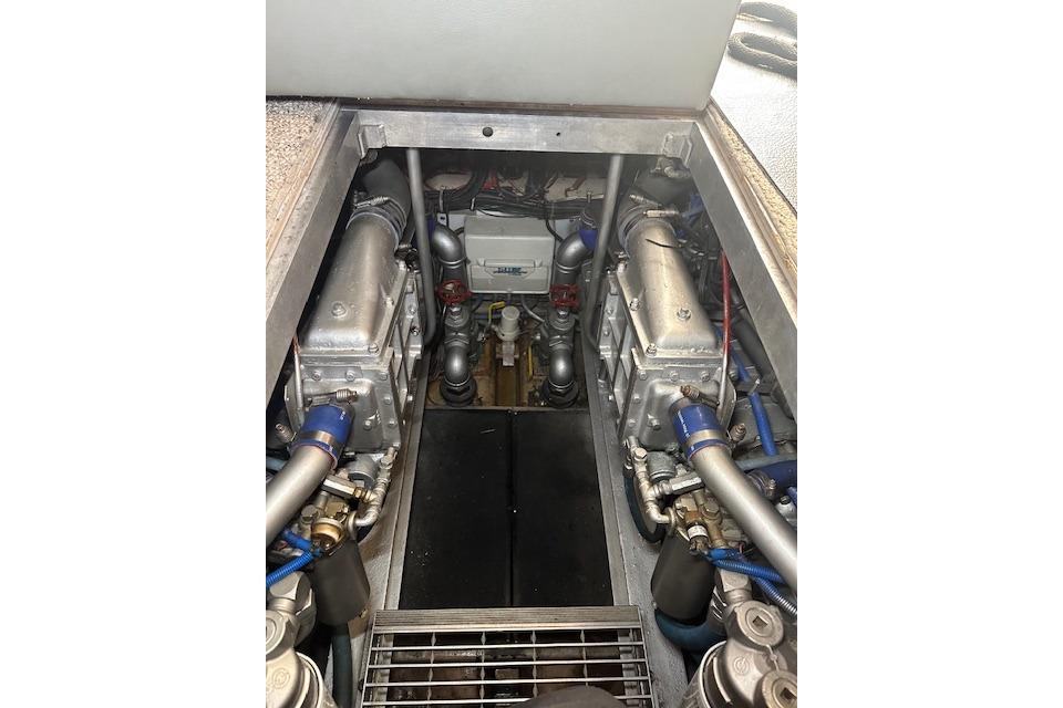 Engine room of 1989 Viking 41 Sportfish Convertible boat, showcasing mechanical components.