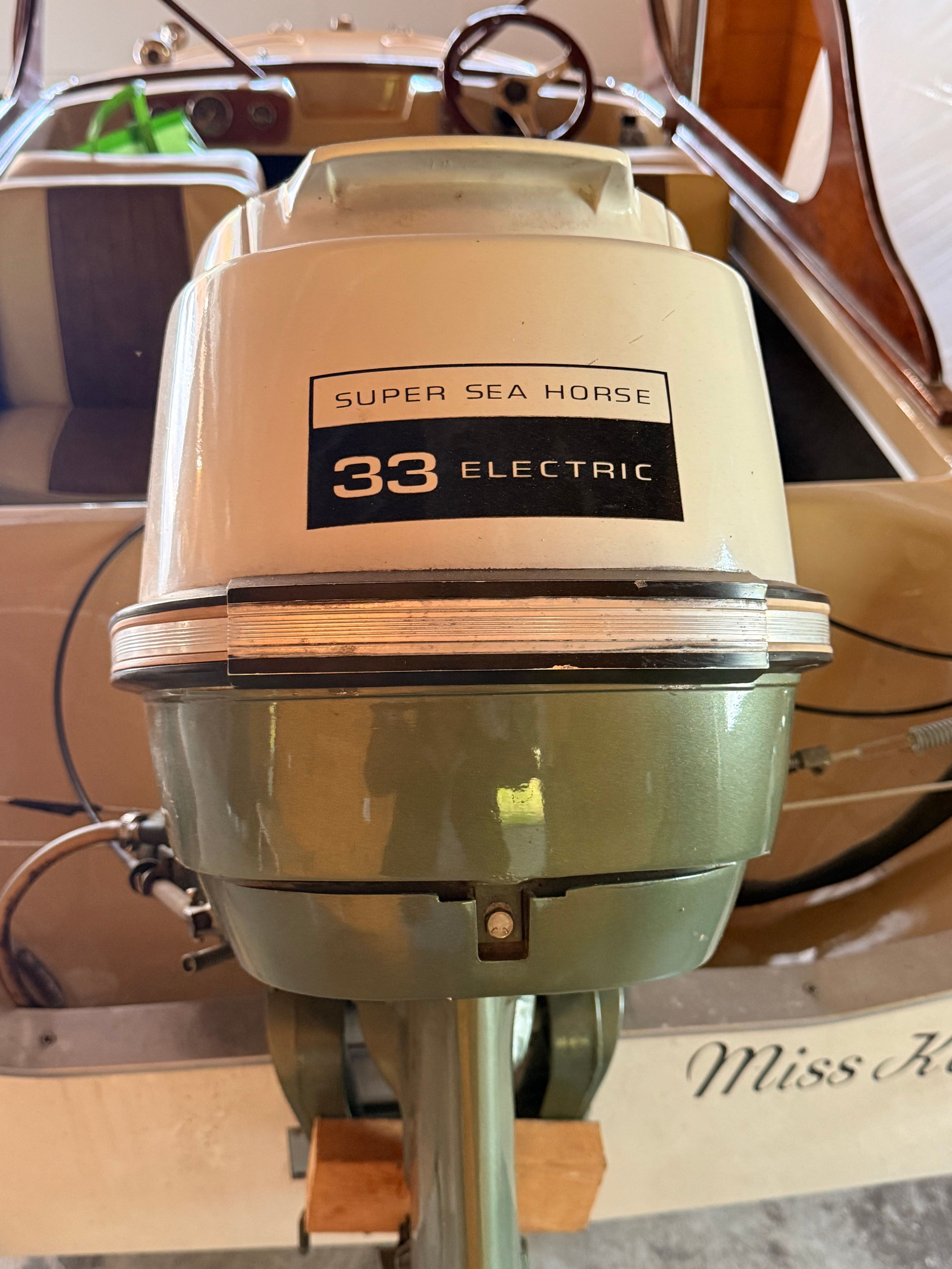 A vintage boat with a Super Sea Horse 33 electric motor in the interior.