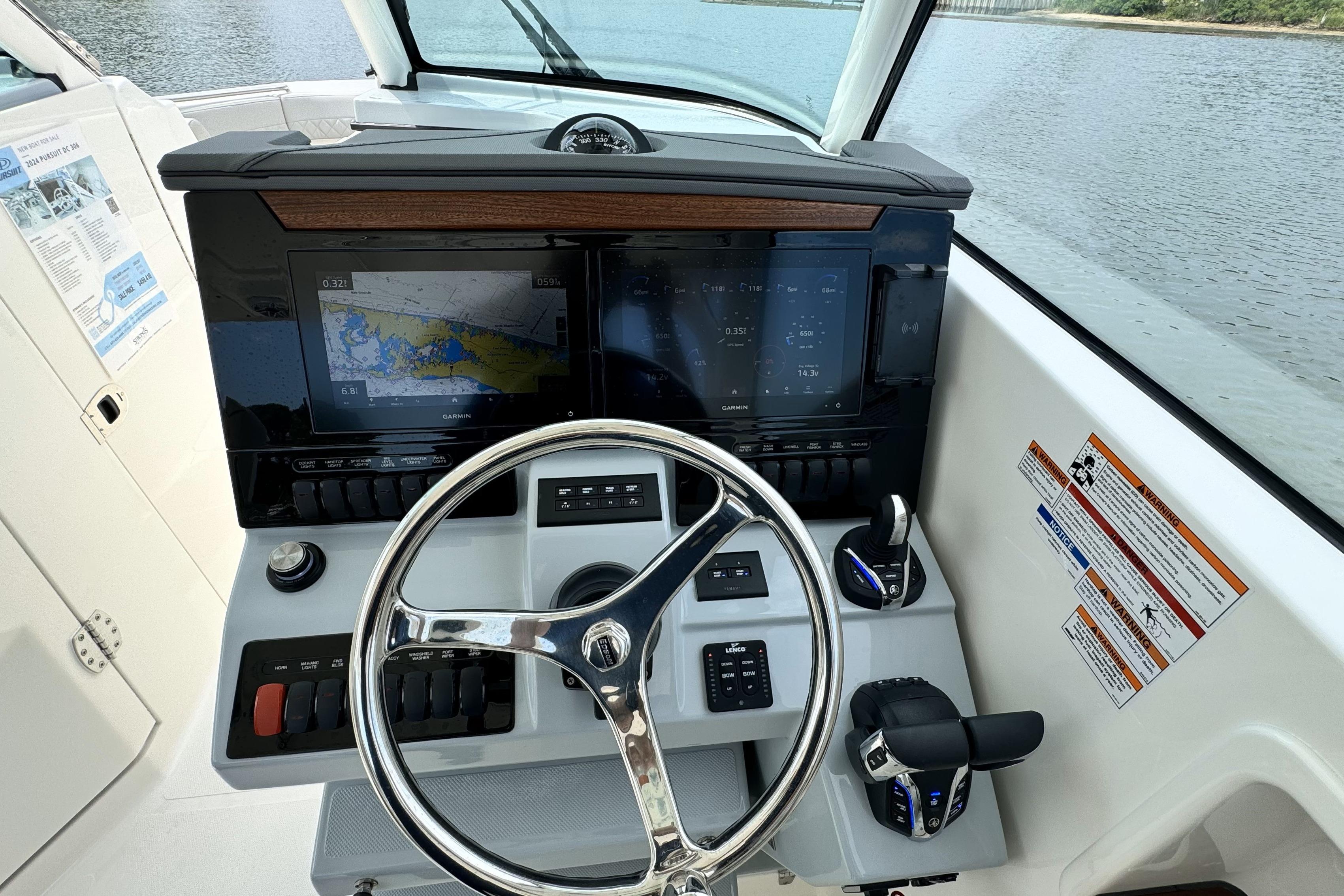 2026 Pursuit DC 306 Dual Console helm with advanced navigation displays and controls.