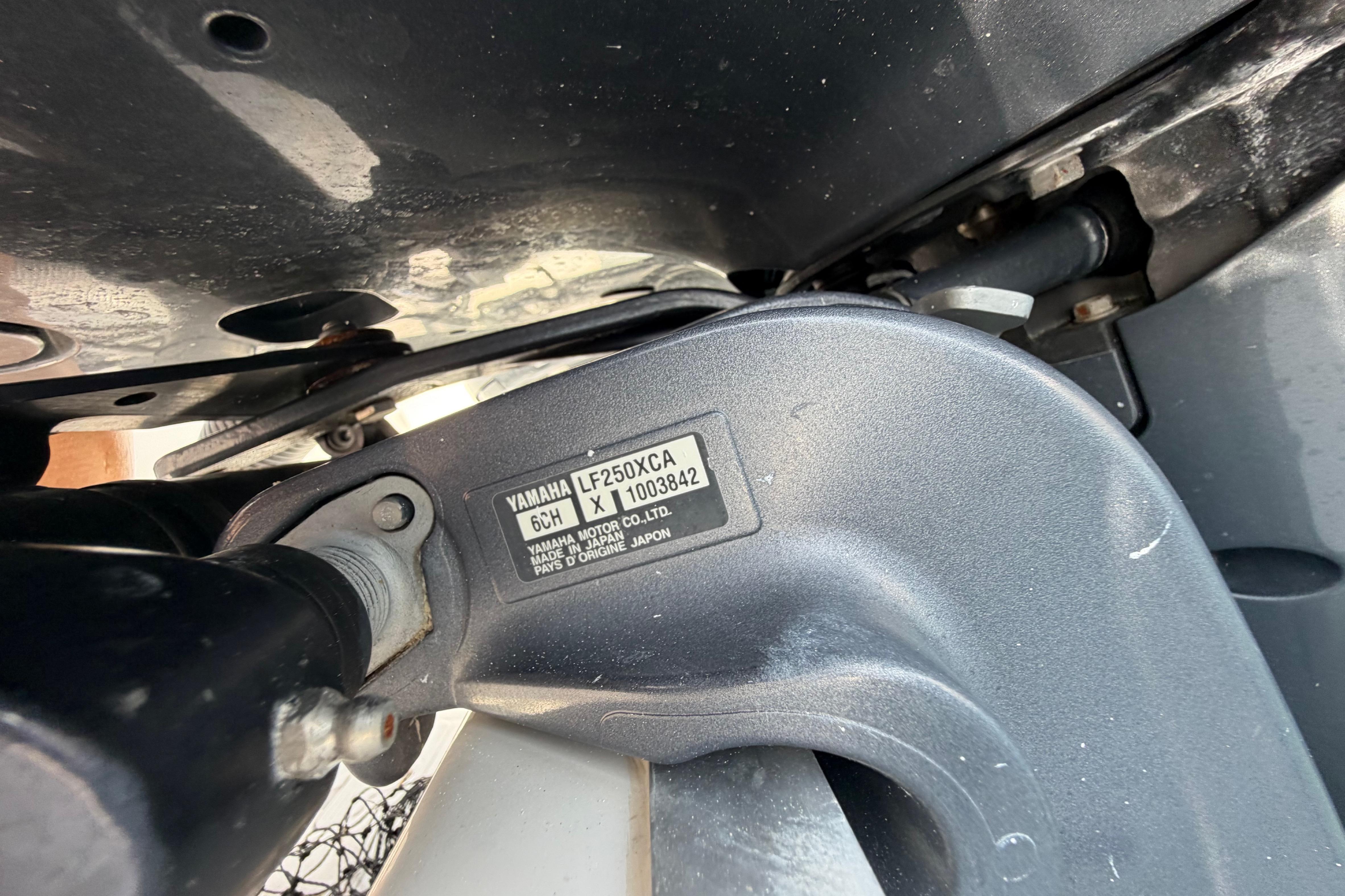 Close-up of a Yamaha LF250XCA engine part on a 2019 Sea Hunt Gamefish 27 Coffin Box boat.