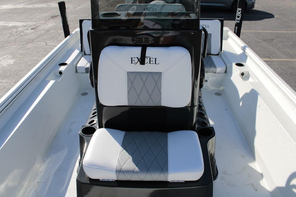 2025 Excel Bay Pro Elite 230 boat interior with cushioned seating and console.
