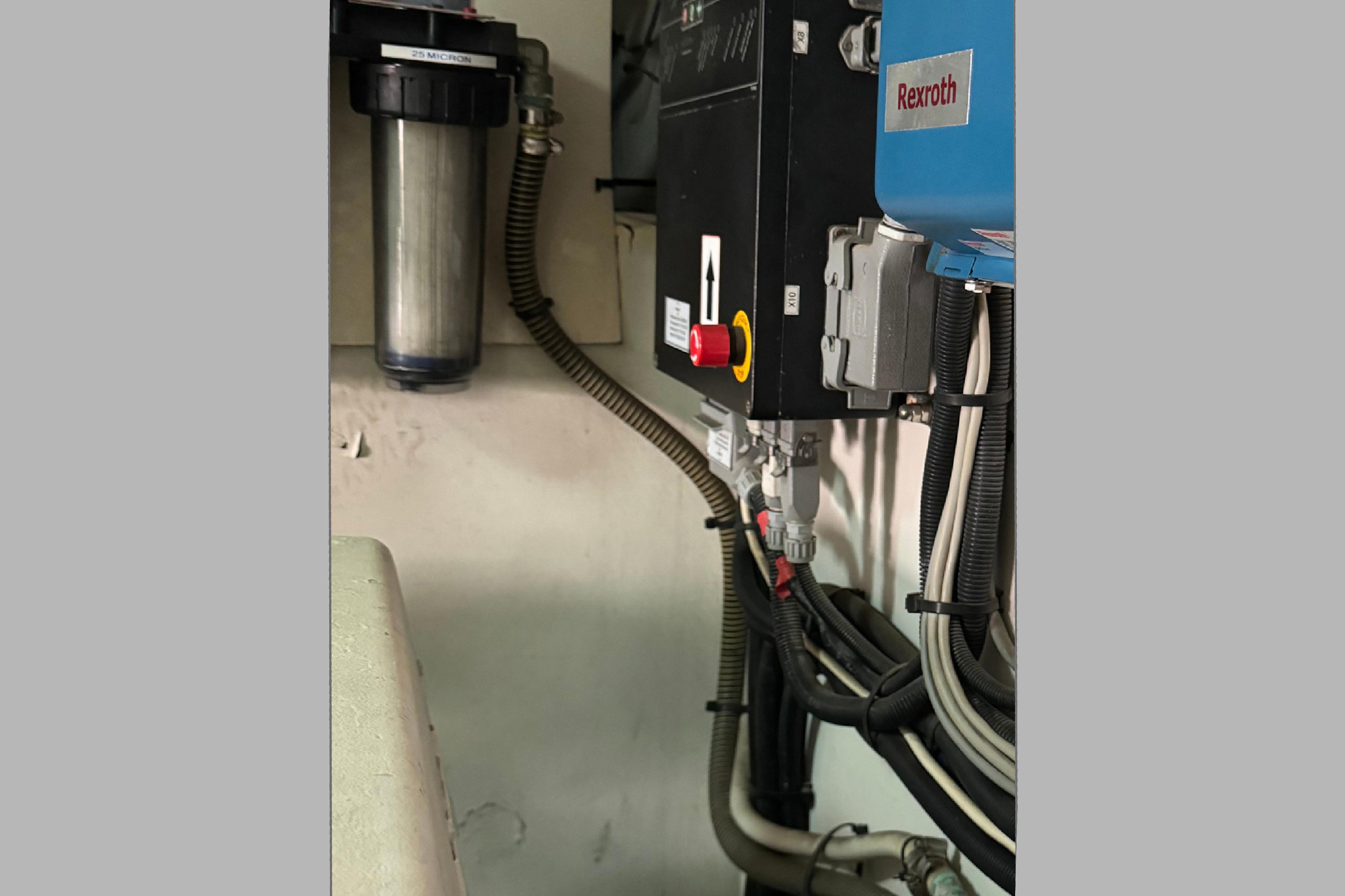 Engine room components of a 2004 Princess V65 yacht, featuring Rexroth equipment and wiring.