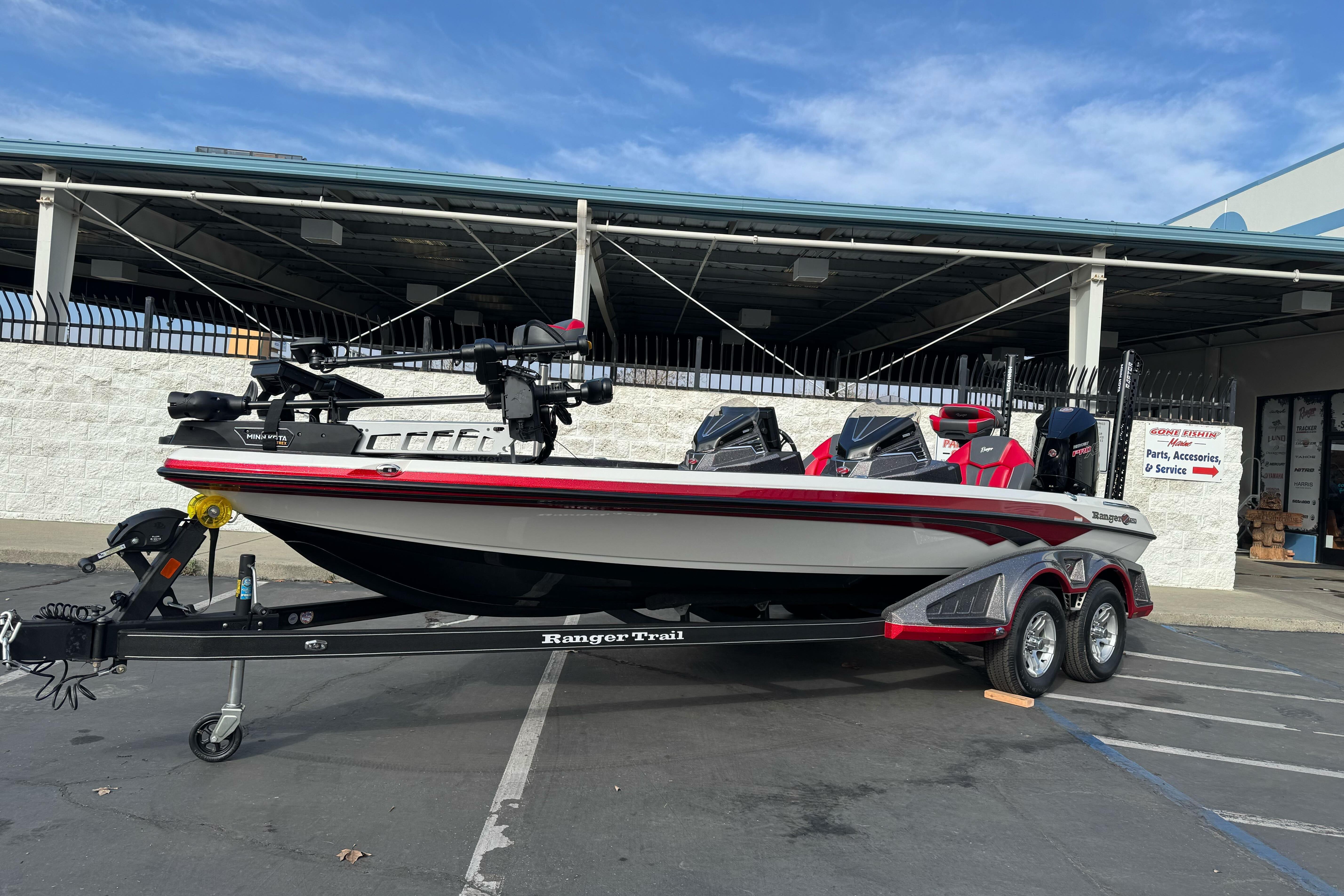 2025 Ranger Z521 boat on trailer, parked outside a service center.
