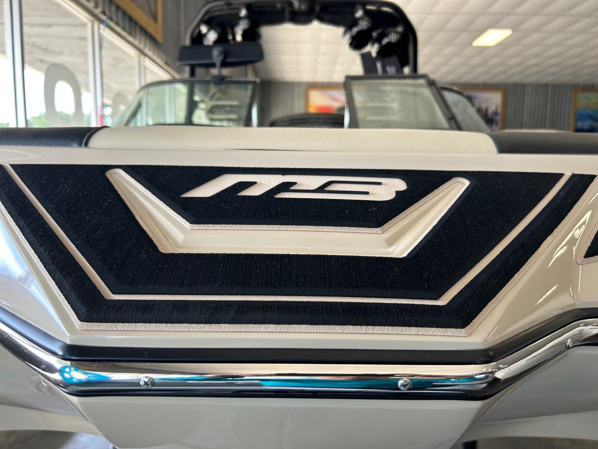 2024 MB F22 Tomcat boat interior with logo detail in showroom.