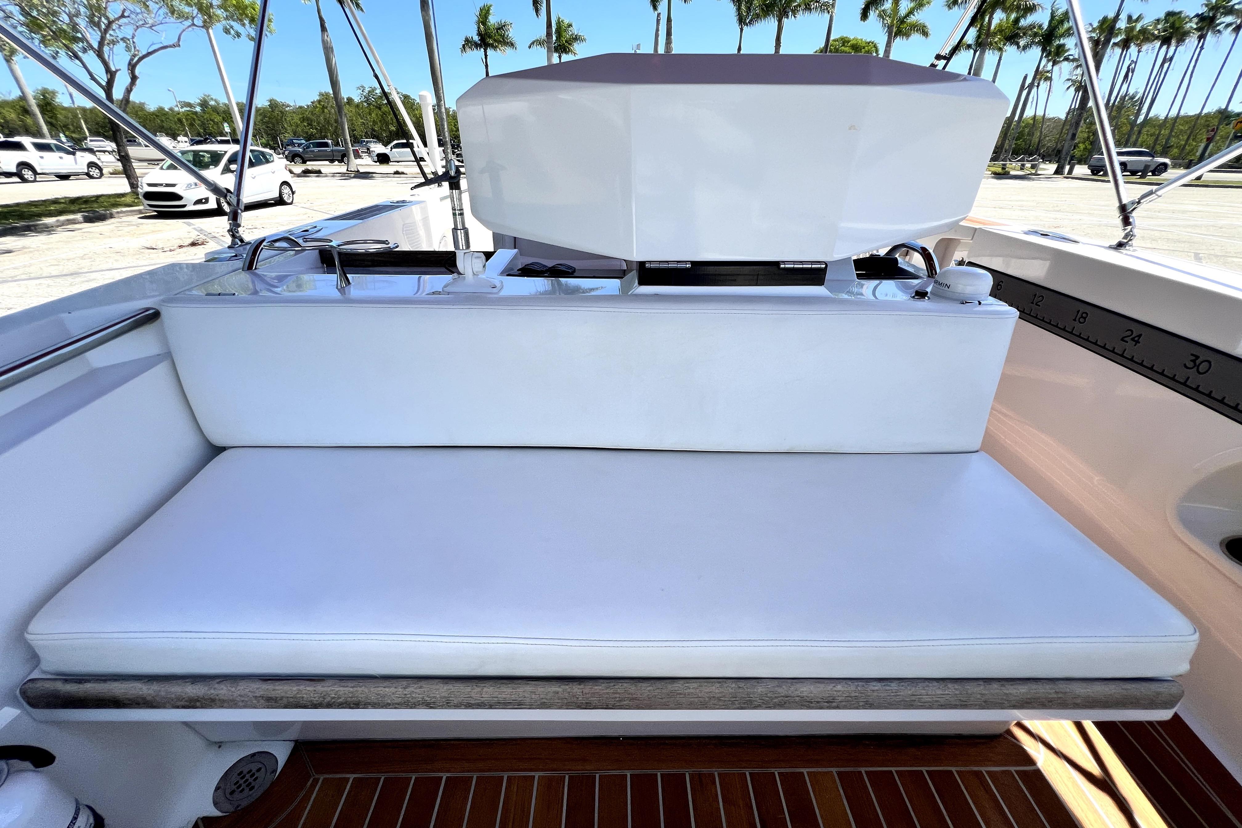 2013 Novurania Chase 23 boat interior with white seating and teak flooring.