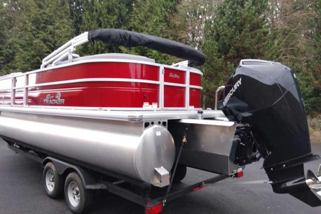 2026 Sun Tracker Party Barge 22 XP3 pontoon boat with Mercury outboard motor.