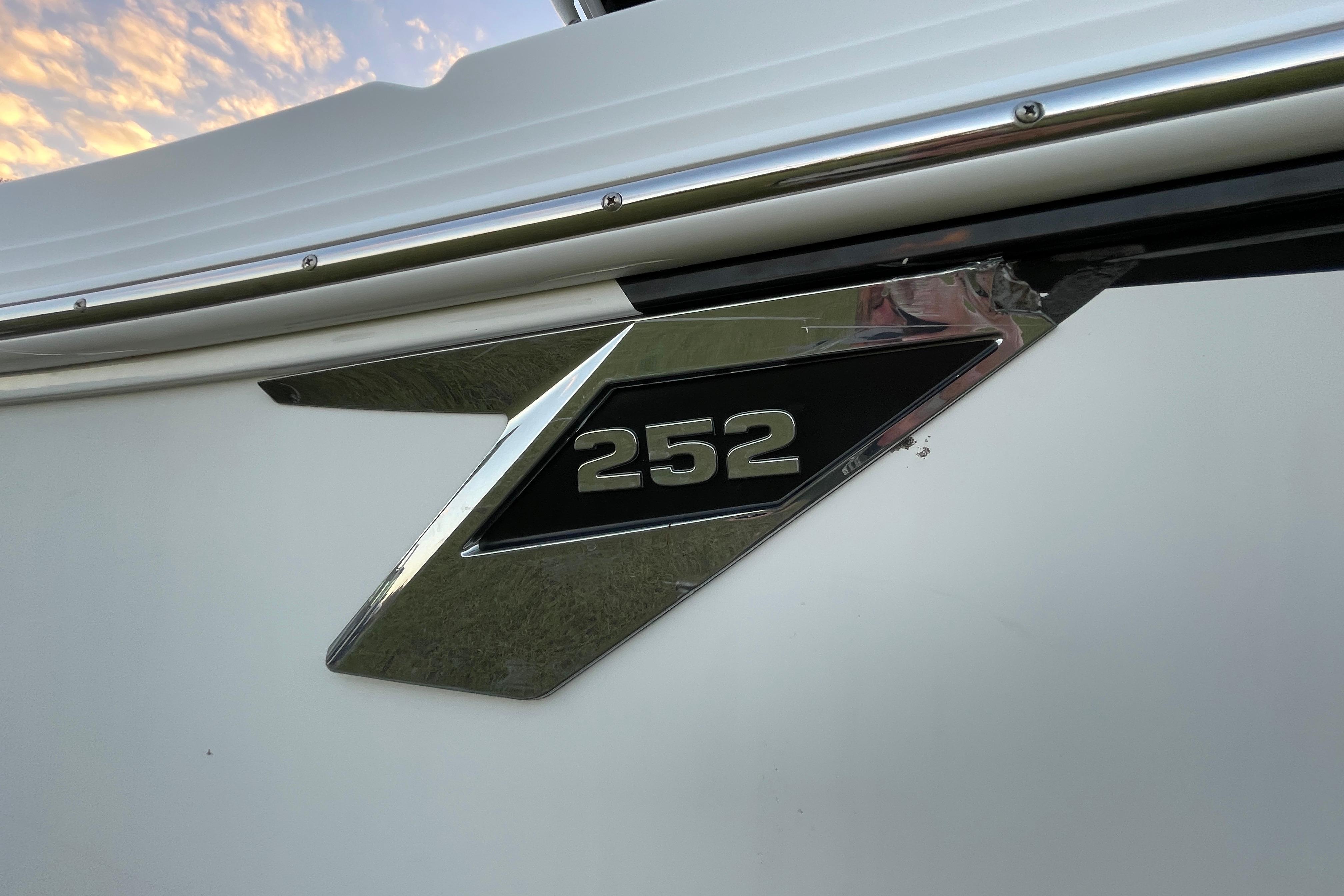 2022 Blackfin 252 CC boat emblem with chrome detailing.