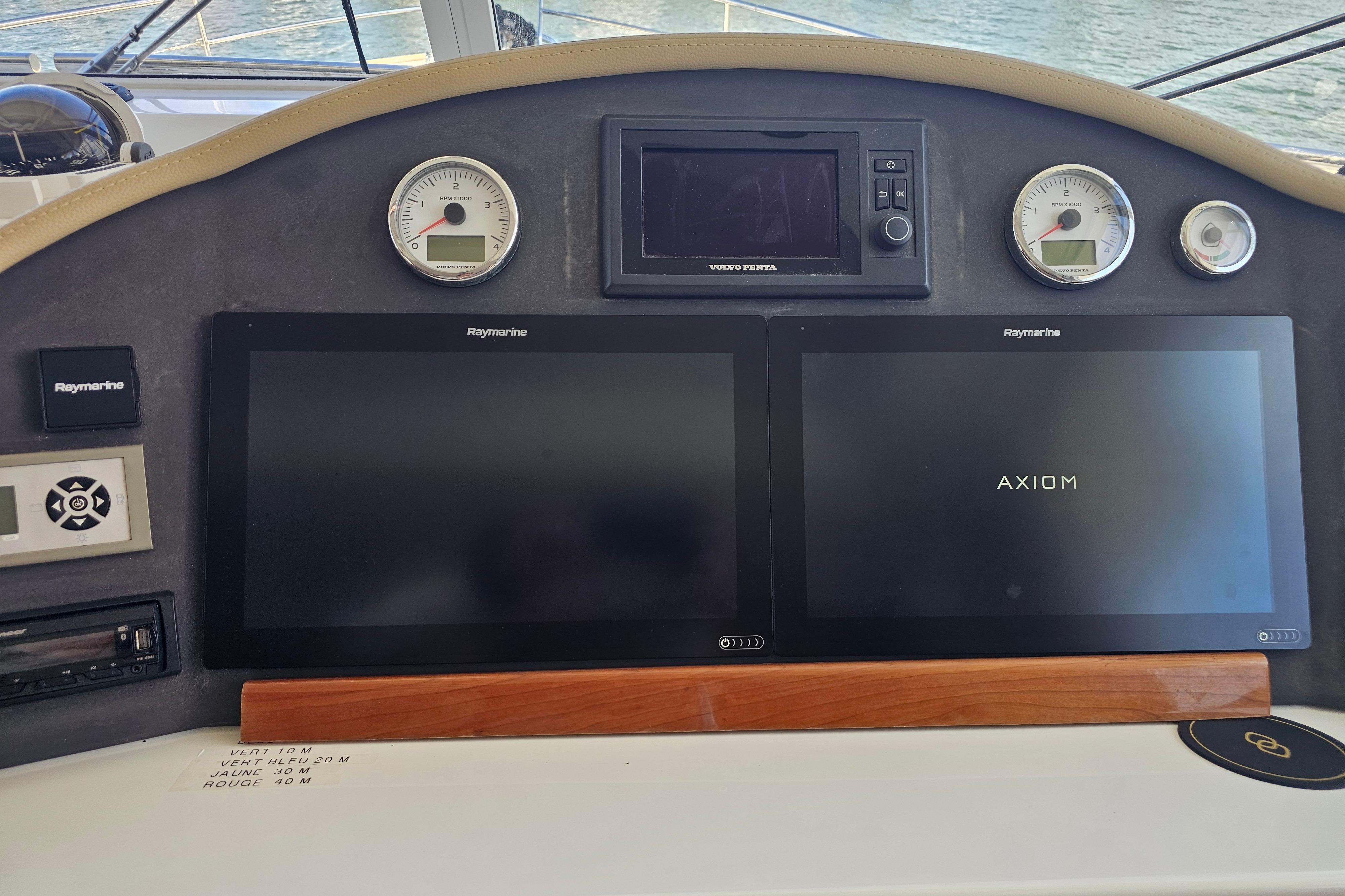 Dashboard of a 2011 Beneteau Swift Trawler 52 with Raymarine displays.