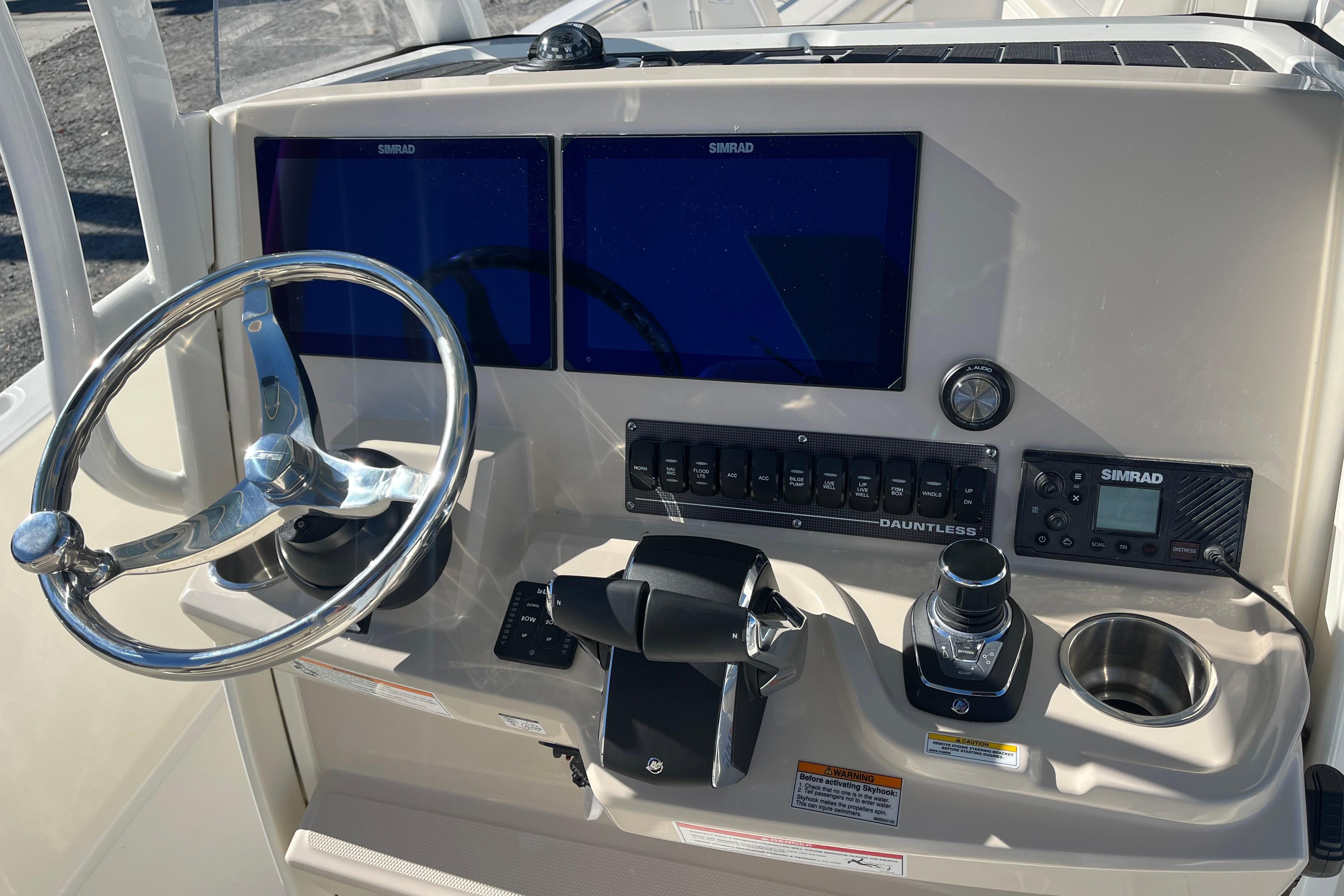 2026 Boston Whaler 280 Dauntless helm with dual Simrad displays and modern controls.