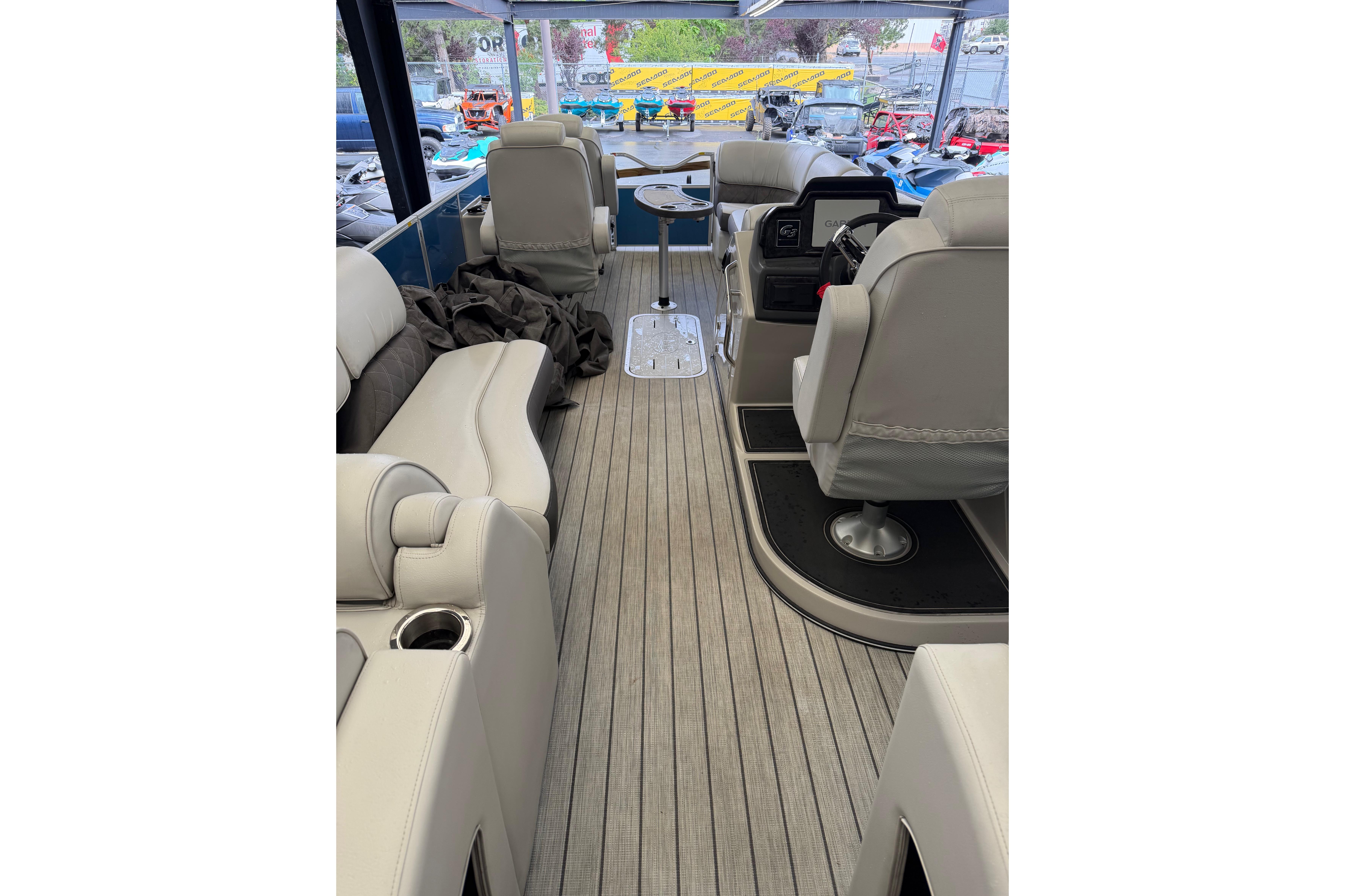 Interior of 2024 SunCatcher Elite 326 SS DLX pontoon boat with luxurious seating.