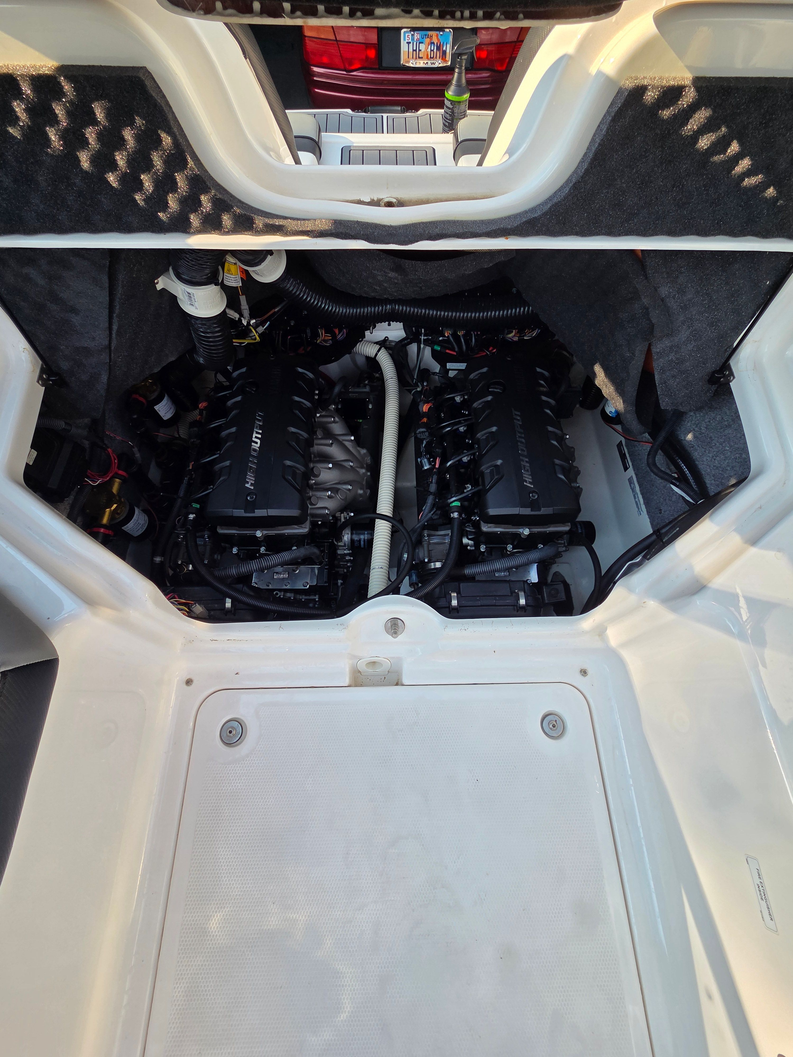 Engine compartment of a 2016 Yamaha 242X E-Series boat with twin engines.