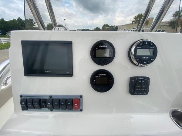 Control panel of 2024 Key West 203 FS boat with gauges and switches.