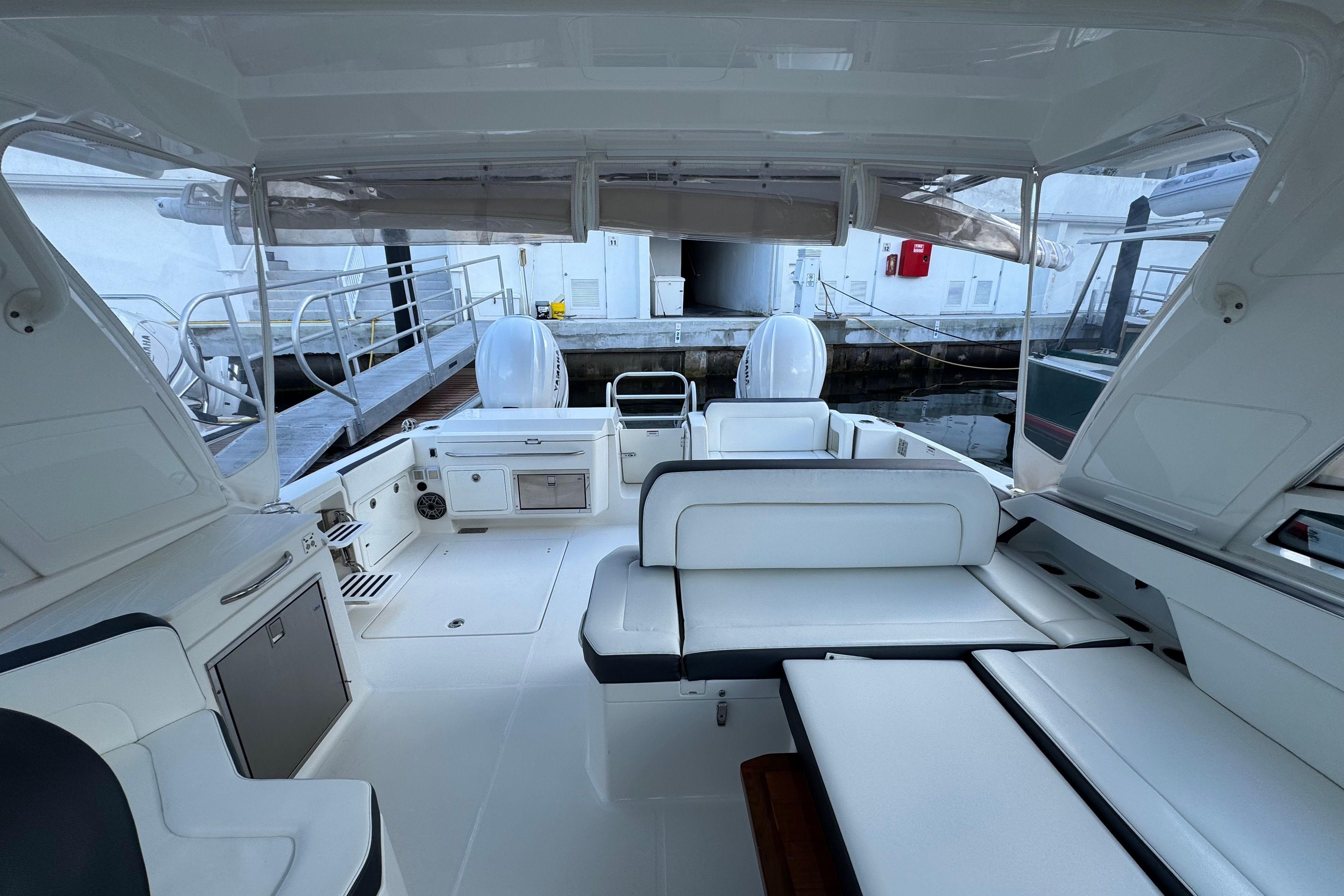 Interior view of 2023 World Cat 400 DC-X boat, featuring spacious seating and modern amenities.