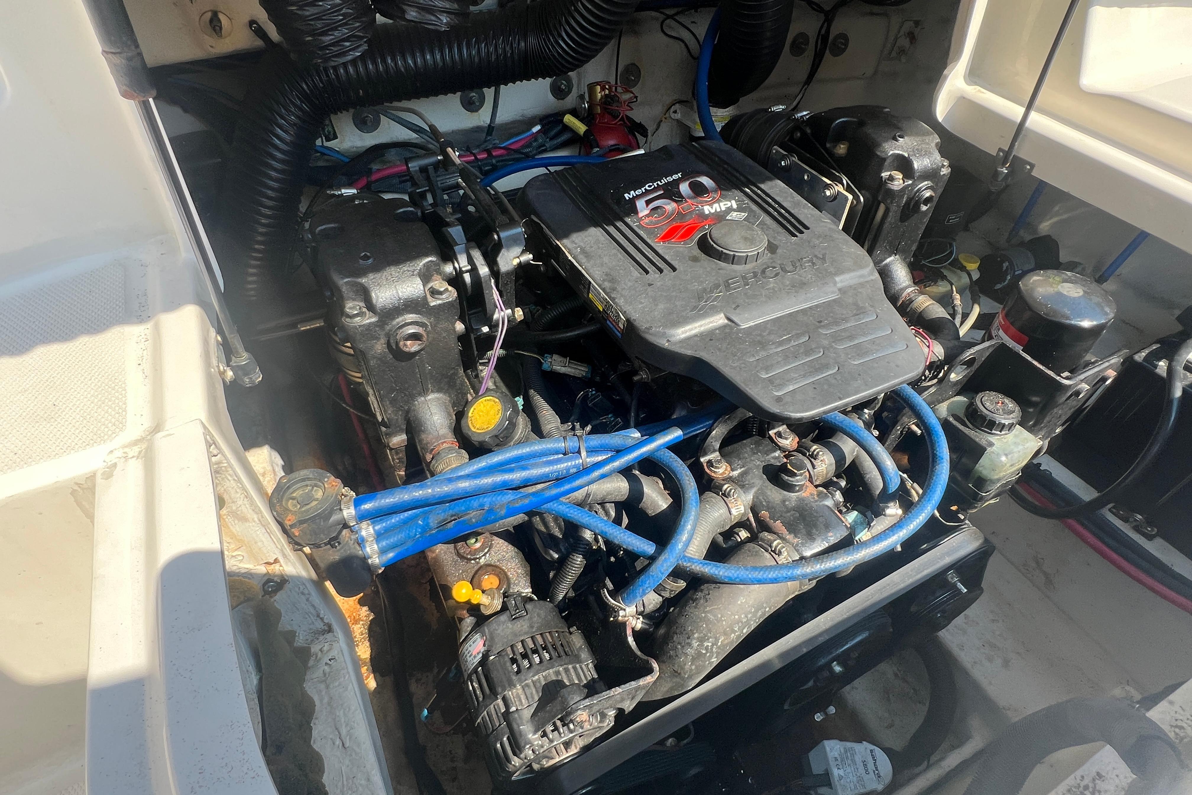 Engine compartment of a 2005 Sea Ray 240 Sundeck with MerCruiser 5.0 MPI engine.