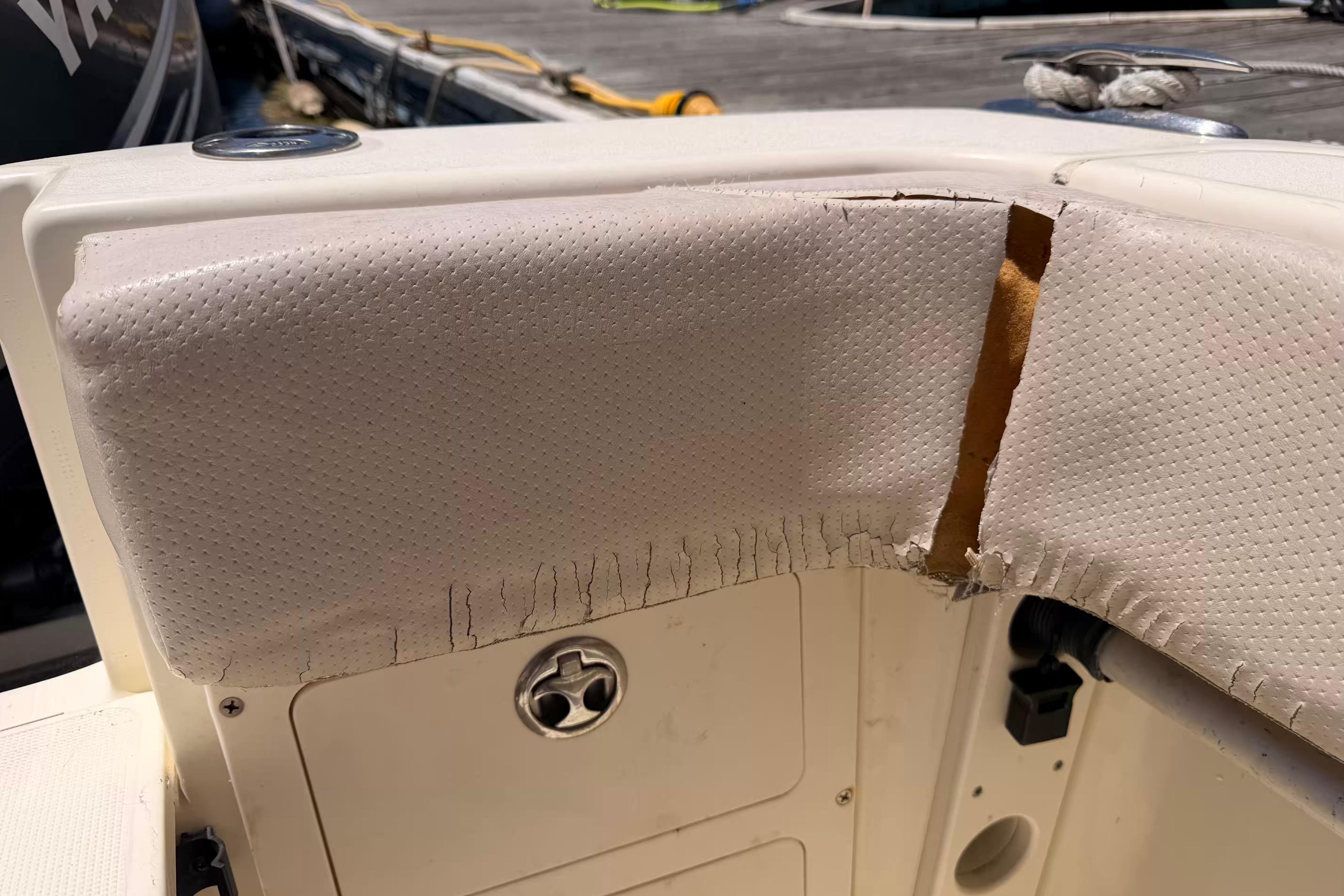 Torn upholstery on a 2007 Scout 262 Abaco boat, showing wear and damage.