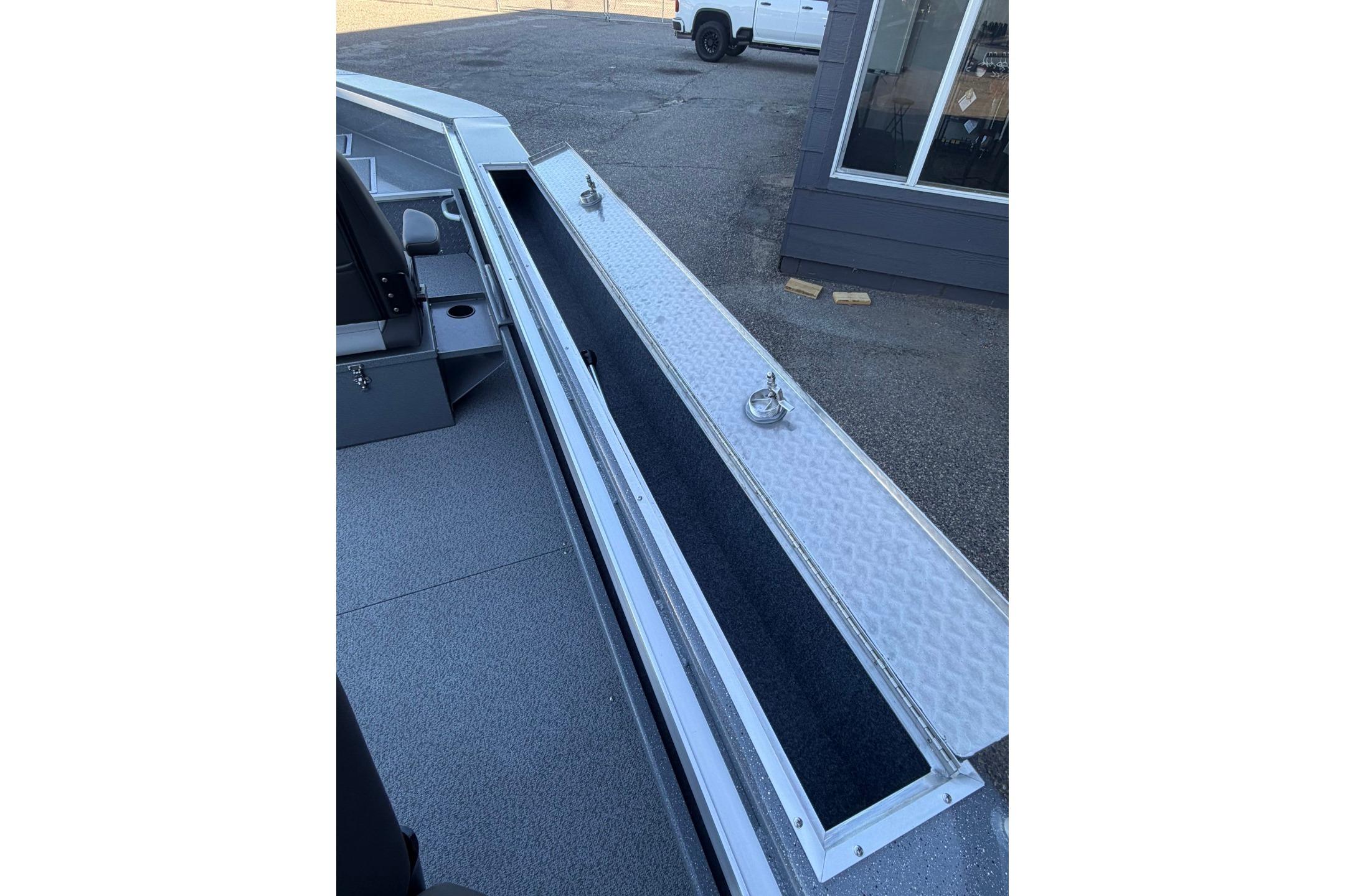 2026 Thunder Jet 209 Rush OT boat interior with open storage compartment.