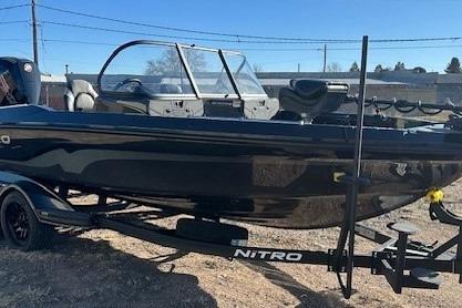 2026 Nitro ZV20 Pro boat on trailer, sleek black design, ready for adventure.