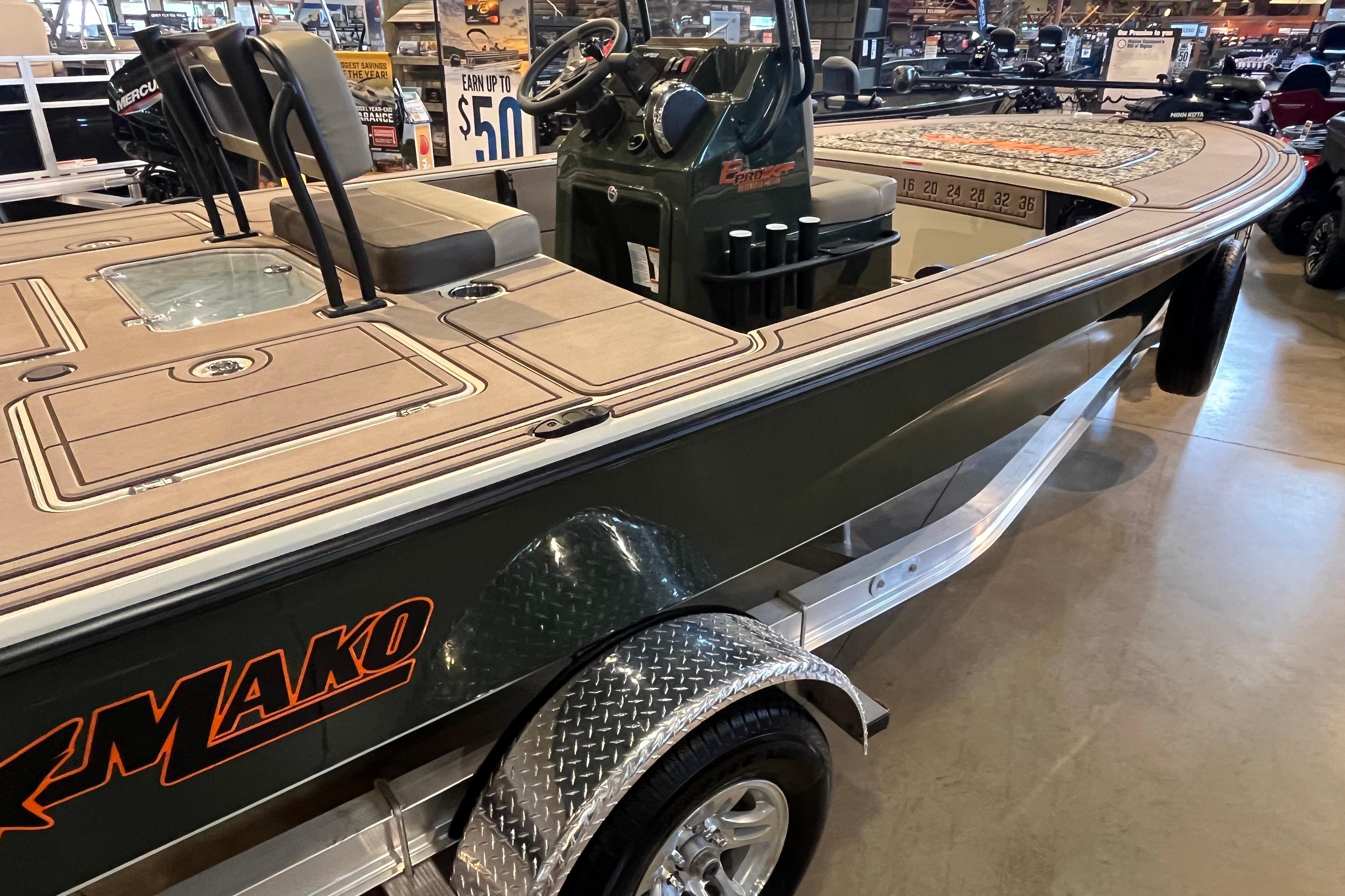 2025 Mako 18 Pro Skiff Backwater Edition boat displayed indoors.