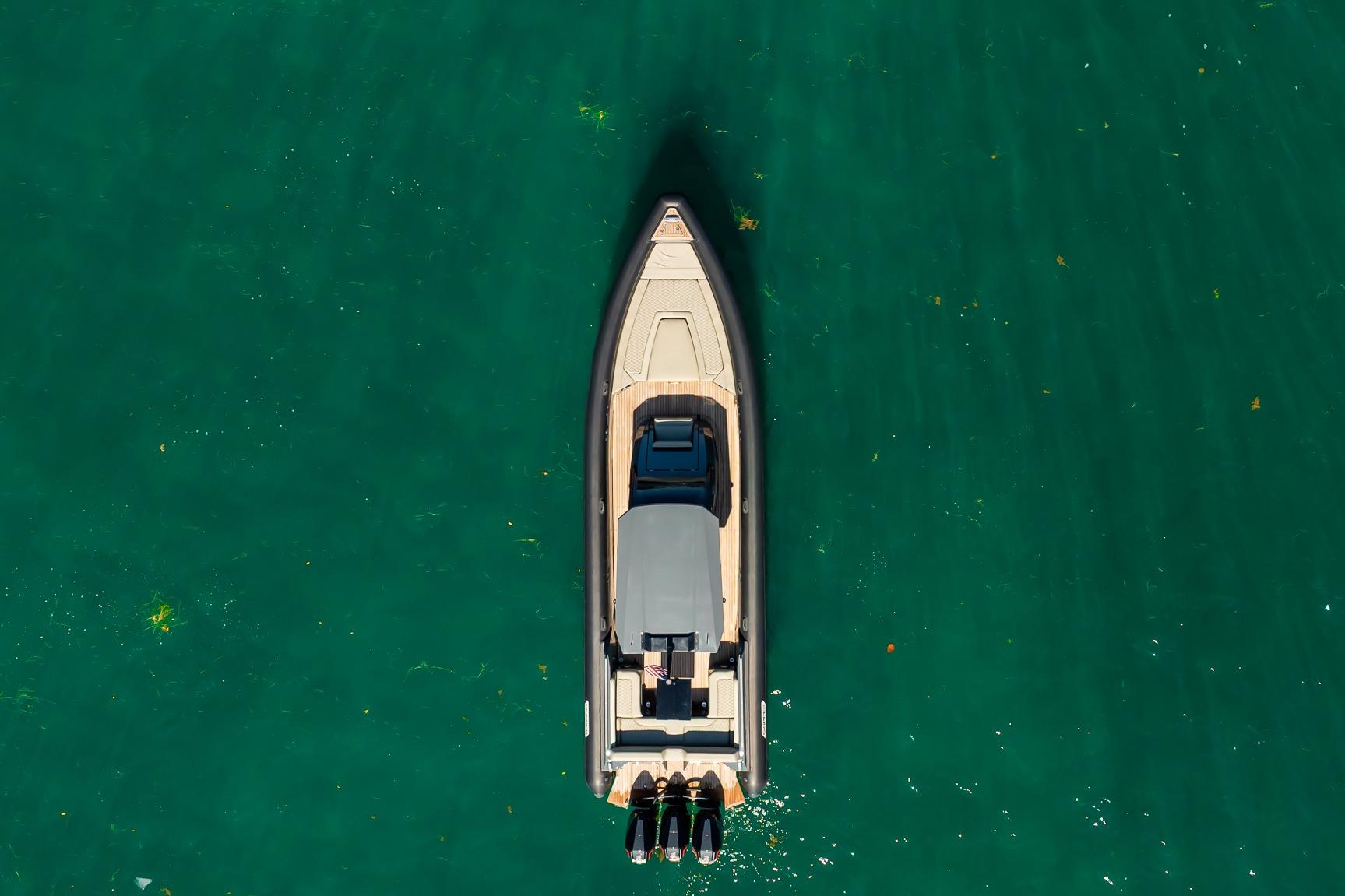 Aerial view of 2023 Skipper-BSK 38NC boat on clear green water.