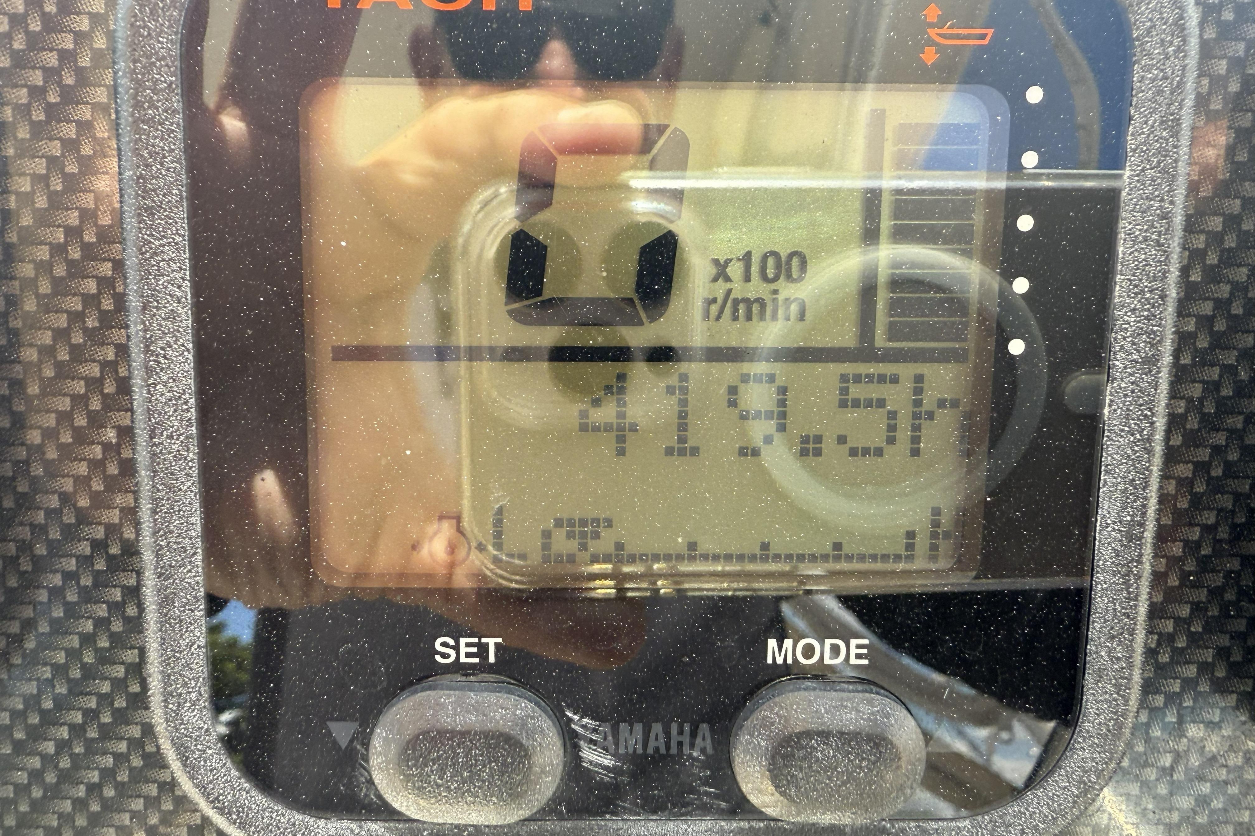 Close-up of a Grady-White Freedom 275 tachometer displaying 419.5 hours.