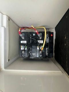 Battery in a compartment of a 2004 Chaparral 190 SSi boat.