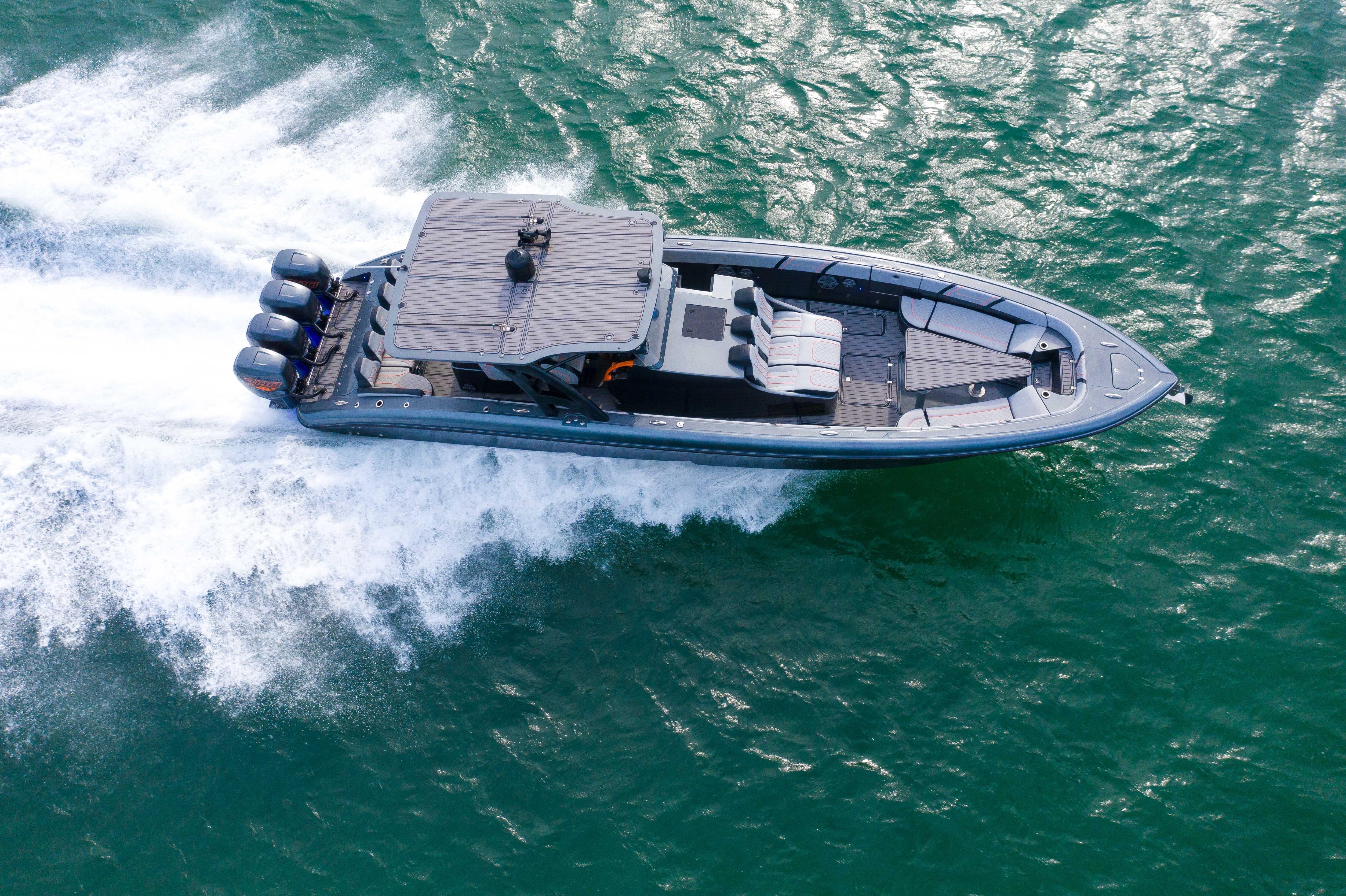 Aerial view of 2019 Midnight Express 43 Open boat cruising on water.