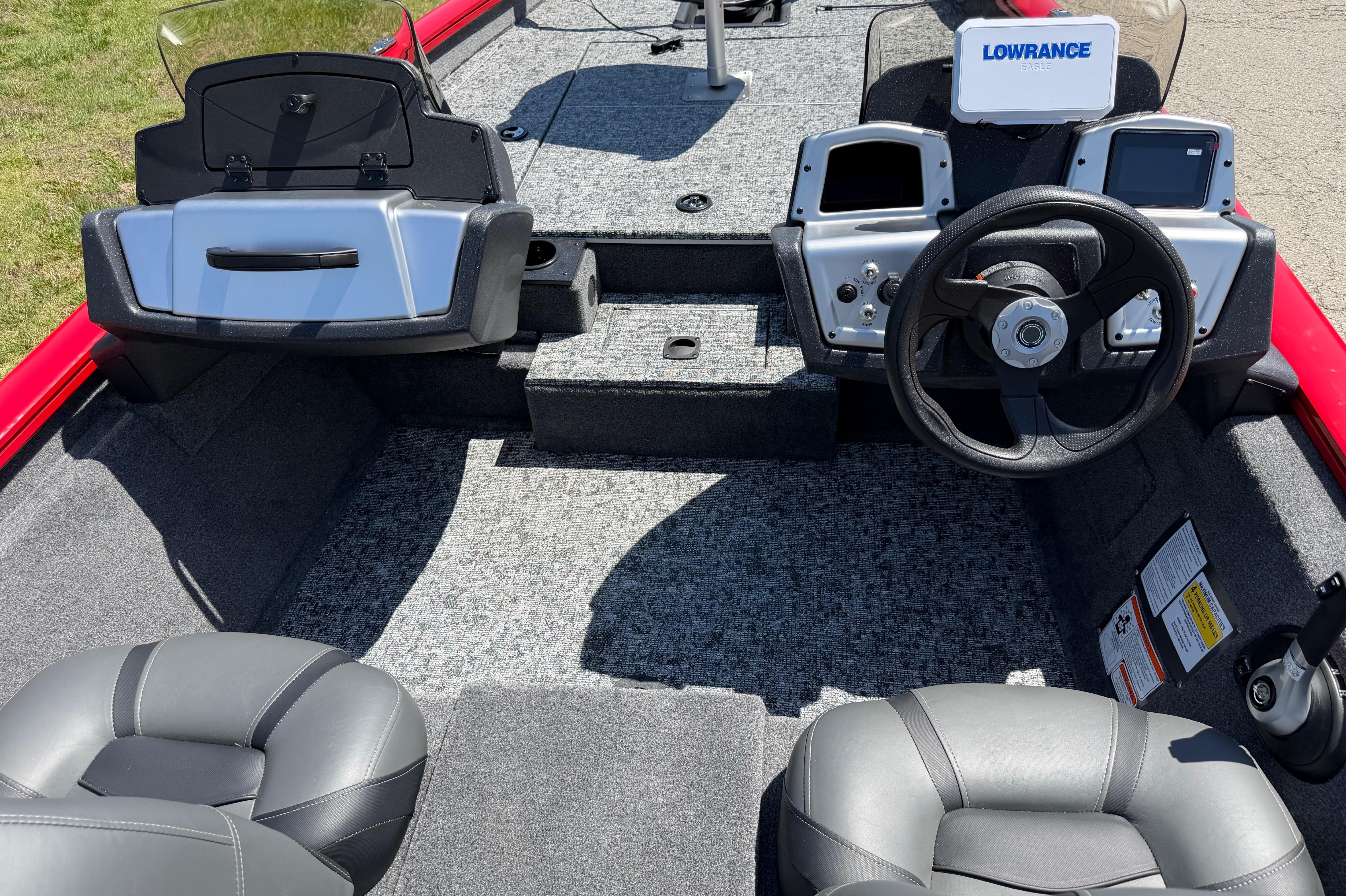 2026 Tracker Pro Team 175 boat interior with steering wheel and Lowrance electronics.