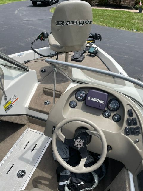 The image shows the cockpit of a 2004 Ranger 190 Reata boat with a Garmin navigation system.