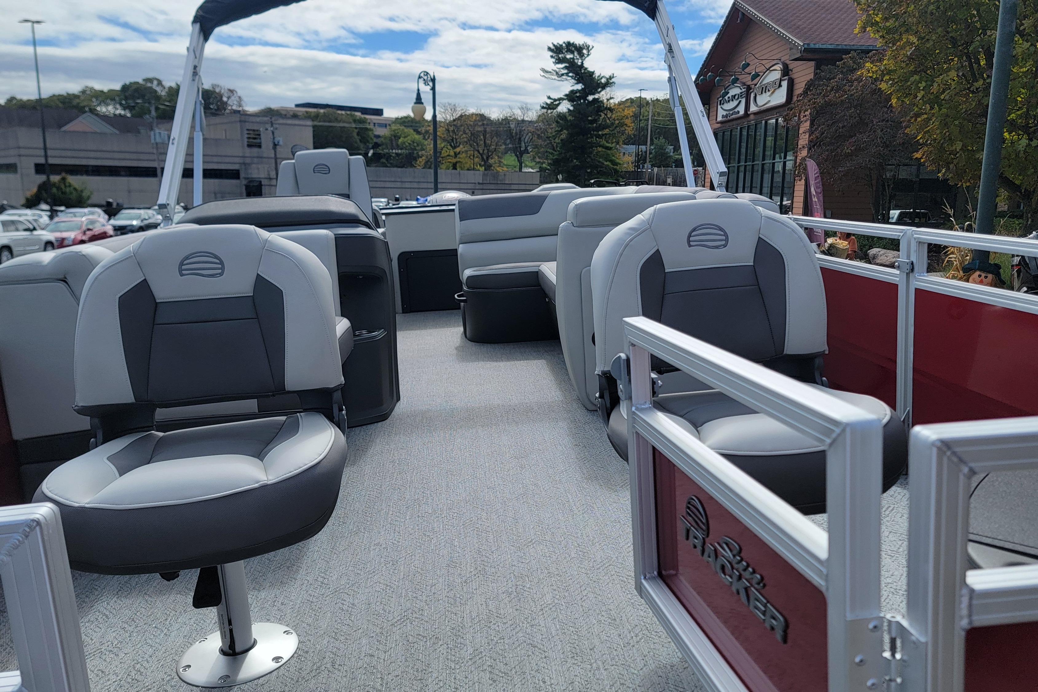 2026 Sun Tracker Fishin' Barge 22 DLX interior with comfortable seating and modern design.