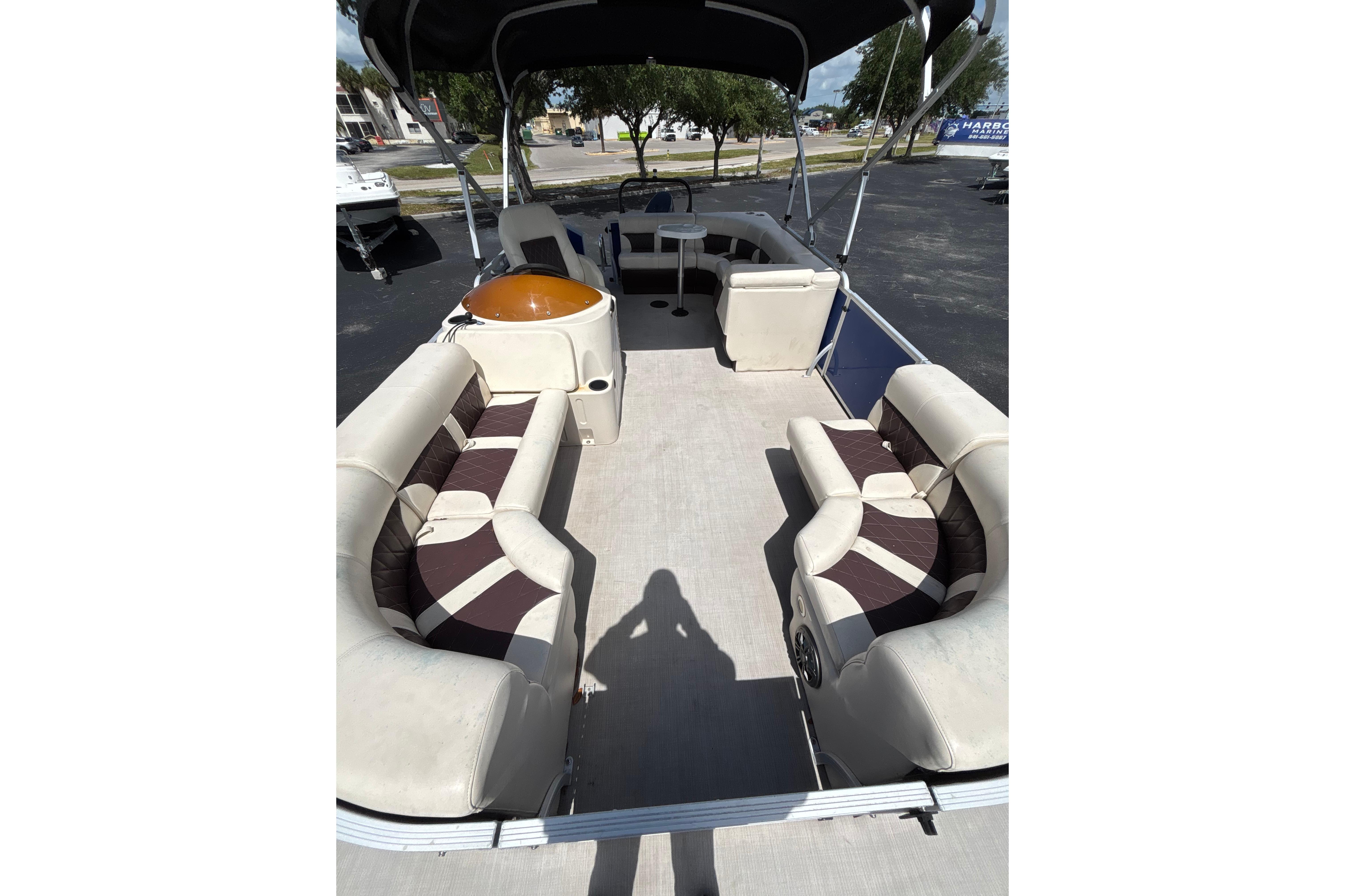 2022 Lexington 323 pontoon boat interior with spacious seating and canopy.