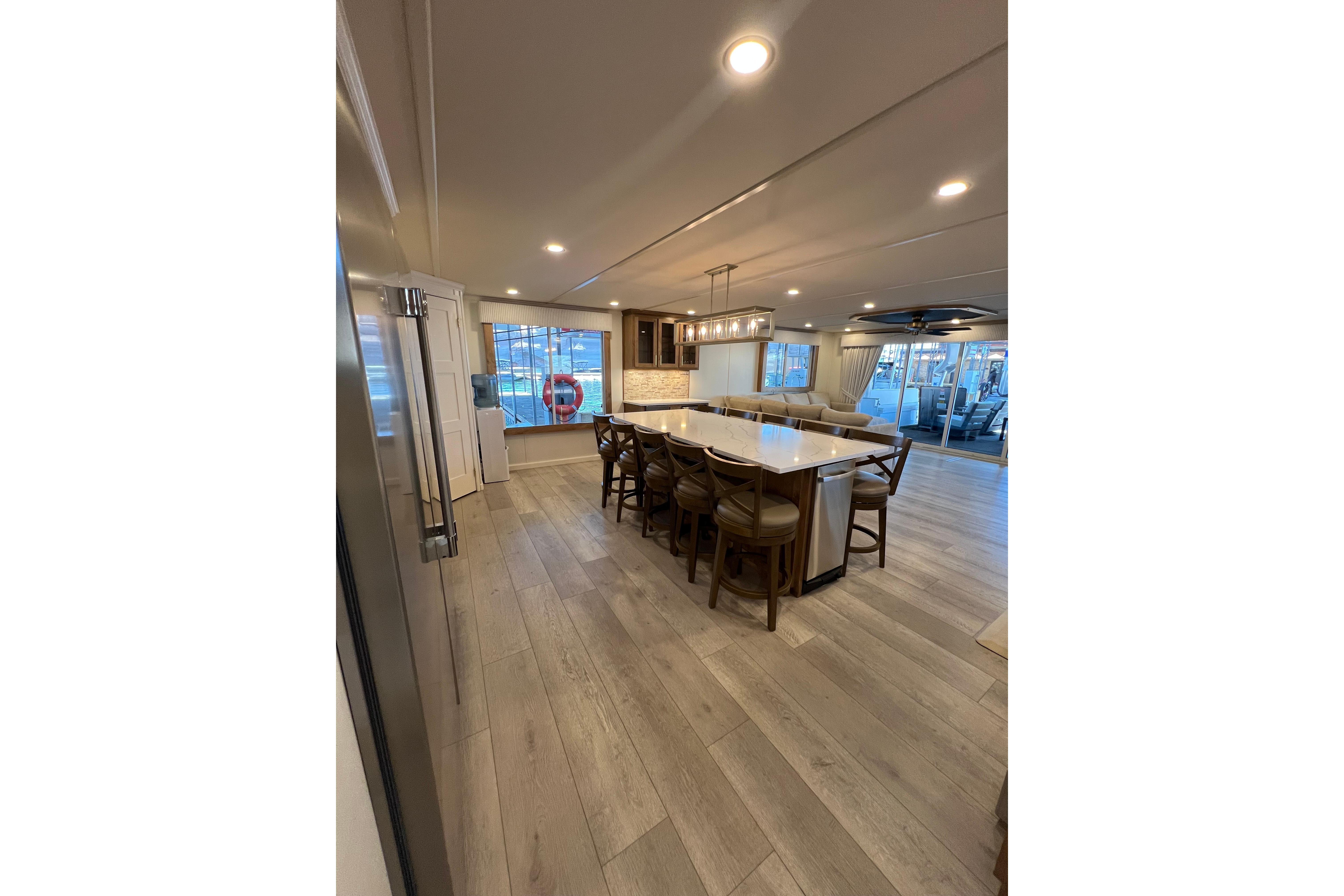 Luxurious Sumerset Excellence 2025 houseboat interior with modern kitchen and spacious seating area.