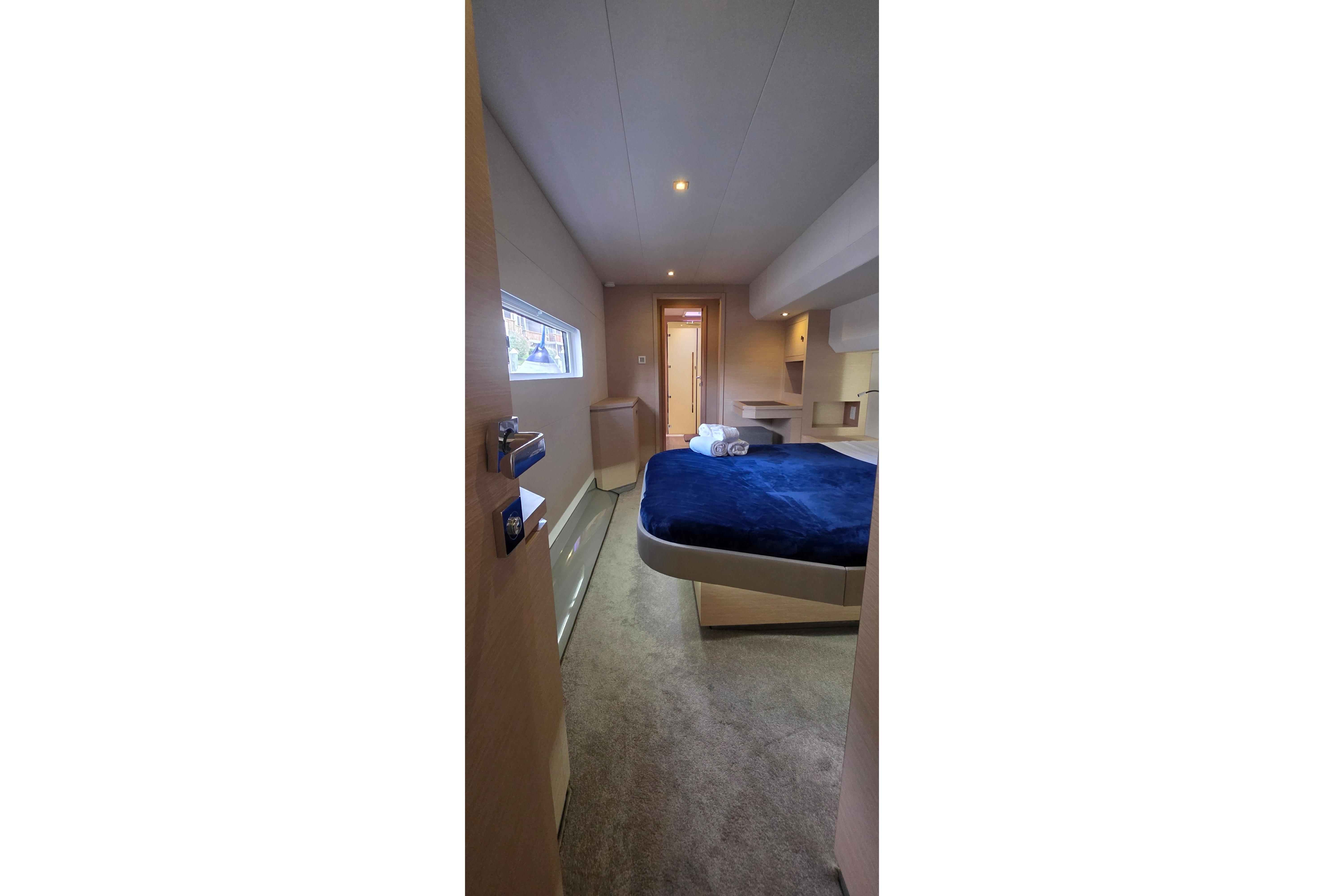 Luxurious cabin interior of 2018 Fountaine Pajot Motor Yacht 44 with cozy bed and modern design.