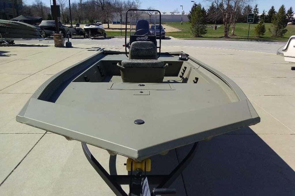 2026 Tracker Grizzly 1860 CC boat displayed outdoors on a sunny day.