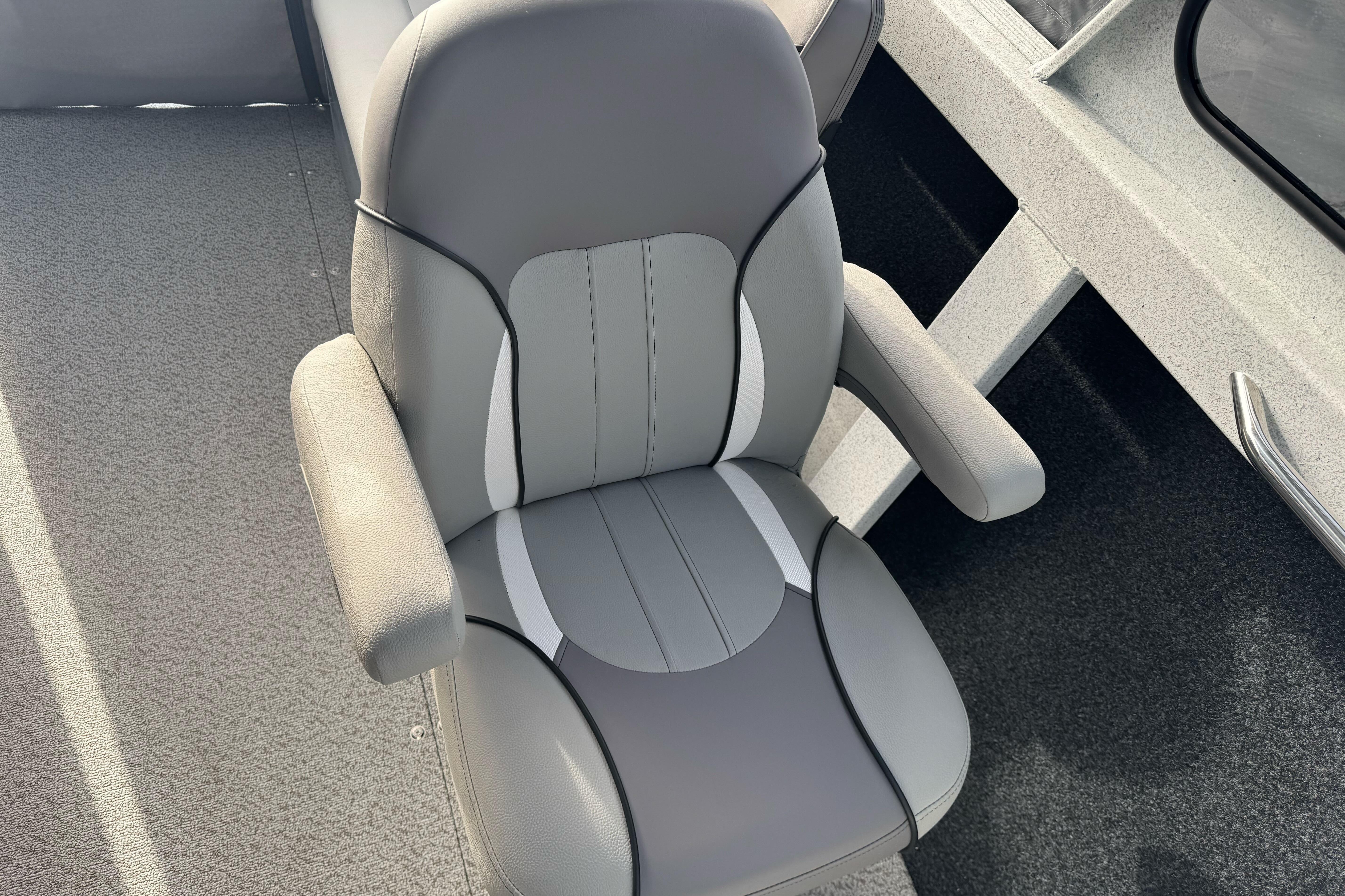 Comfortable seating in KingFisher 2025 Escape boat, 2026 model, featuring sleek gray design.