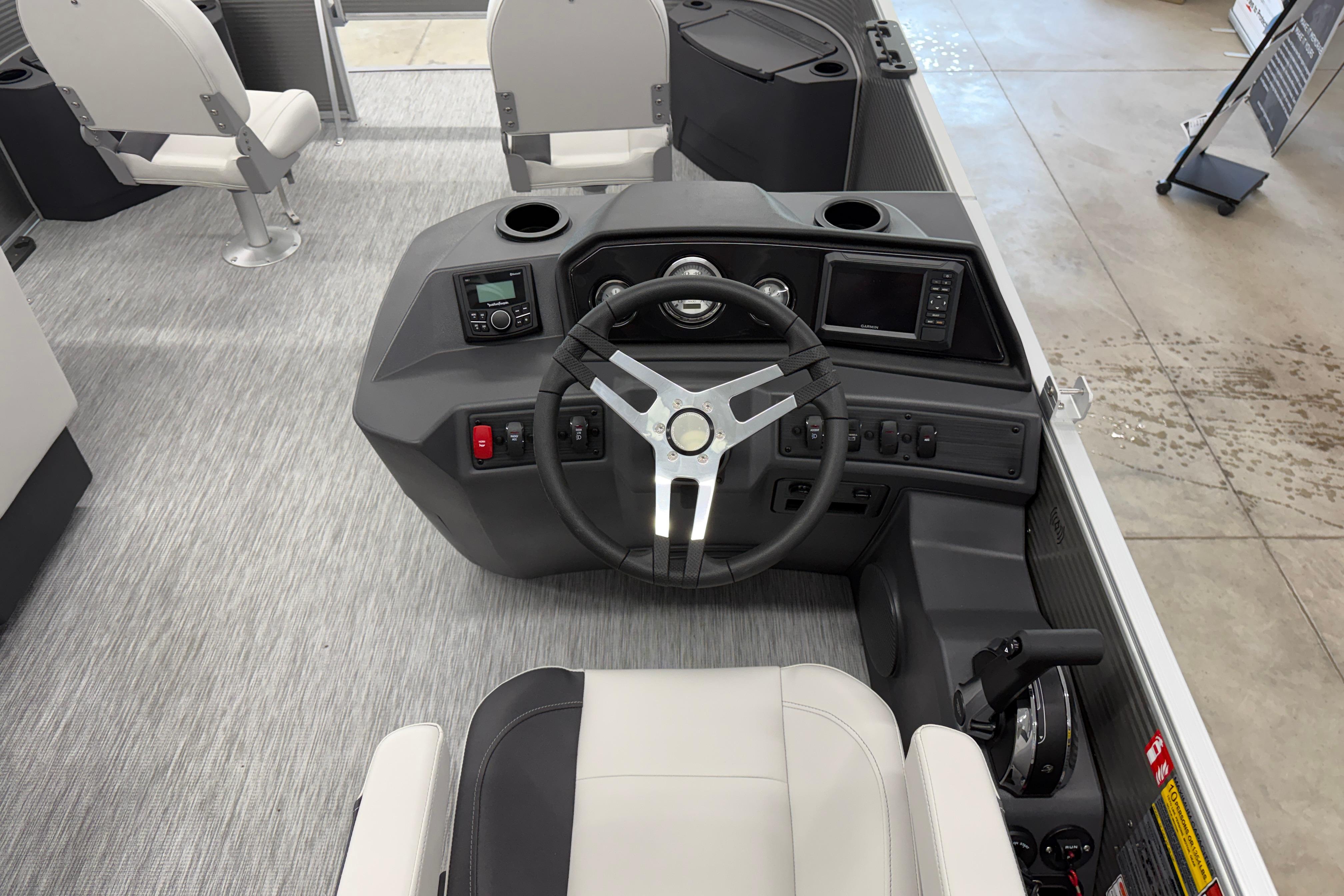 2026 Bennington 20 SF boat interior with steering wheel and control panel.