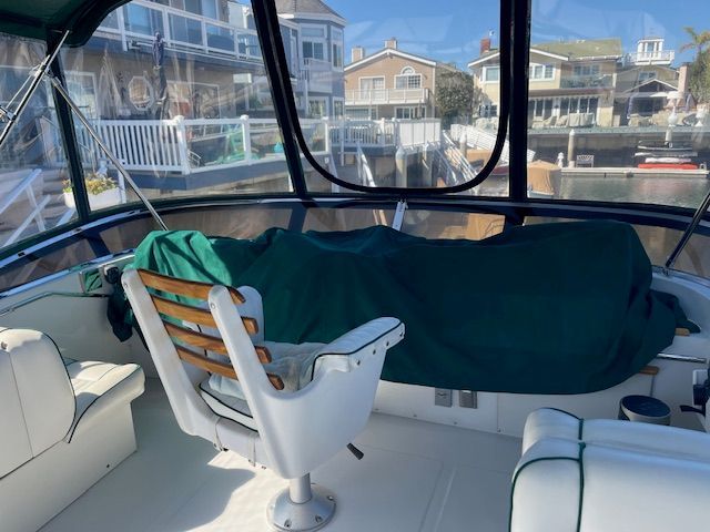 Interior of a 1983 Uniflite 38 Convertible yacht docked at harbor.