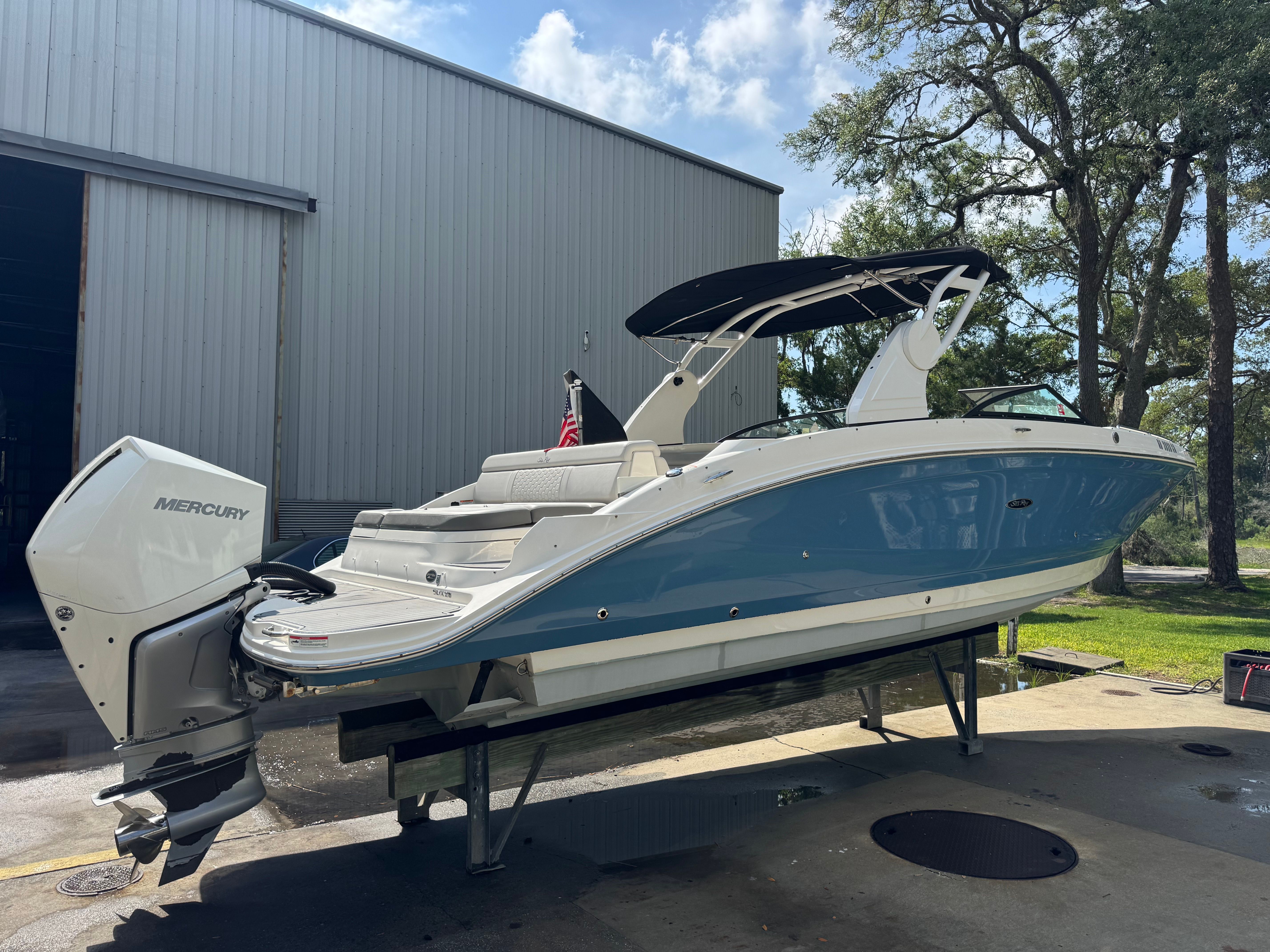 2020 Sea Ray SDX 270 Outboard boat on a trailer.