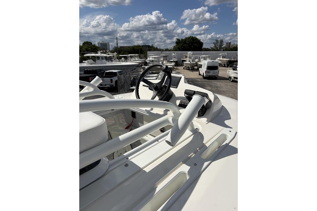 2026 Pathfinder 2800 Hybrid boat dashboard under a partly cloudy sky.