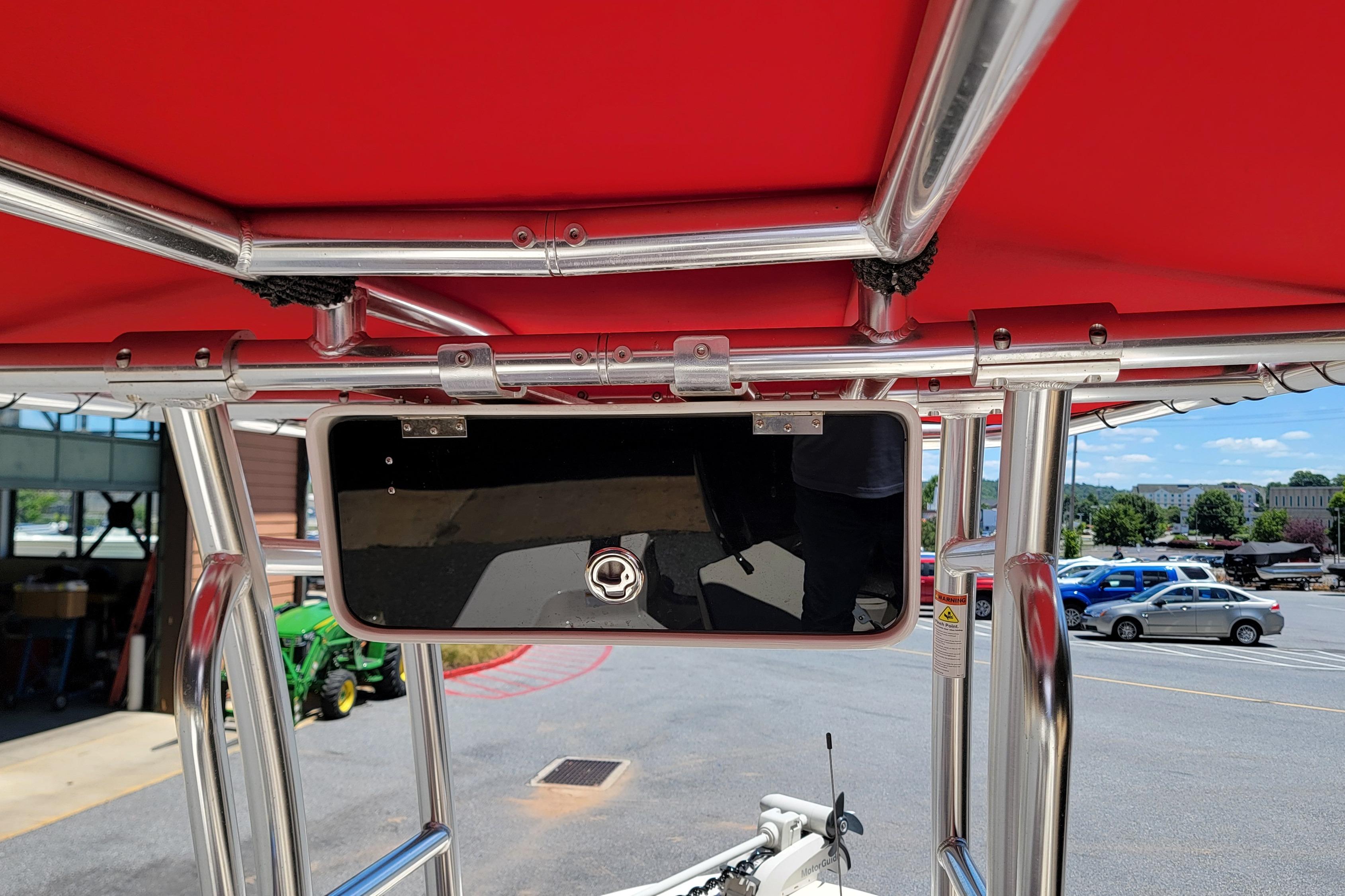 2021 Carolina Skiff 178 JLS boat with red canopy and stainless steel frame.