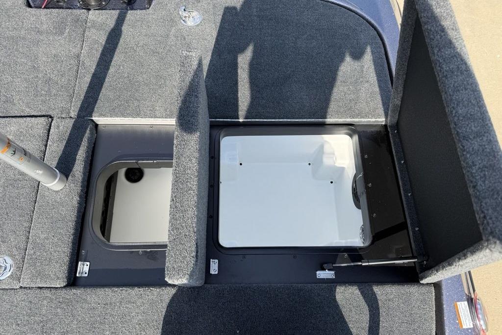 Open storage compartments on a 2026 Skeeter ZXE20 boat deck.