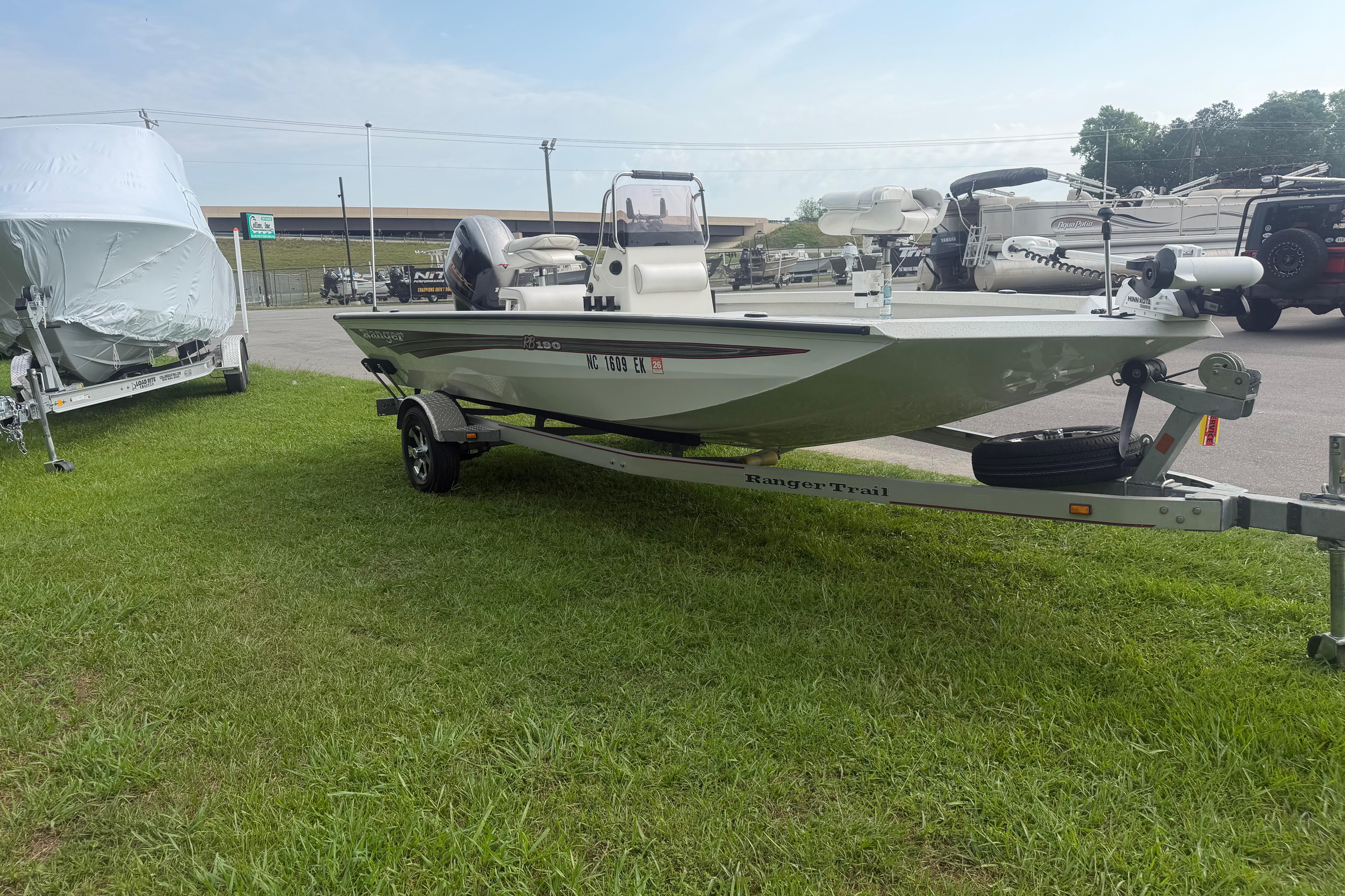 2018 Ranger RB190 boat on trailer, parked on grass, ready for transport.