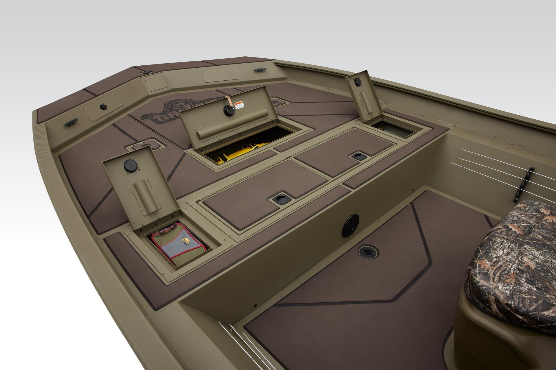 2024 Tracker Grizzly 2072 CC boat interior with storage compartments and camo seat.